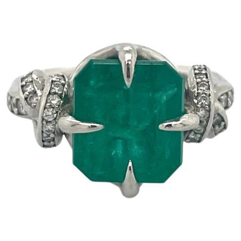 For Sale:  4ct Emerald solitaire in platinum with diamond knots