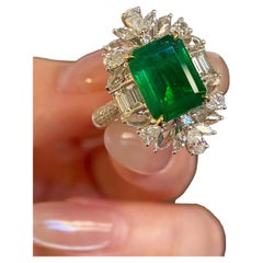 4ct Emerald with 1.50ct Multi-Shape White Diamond Halo Ring in 18k White Gold