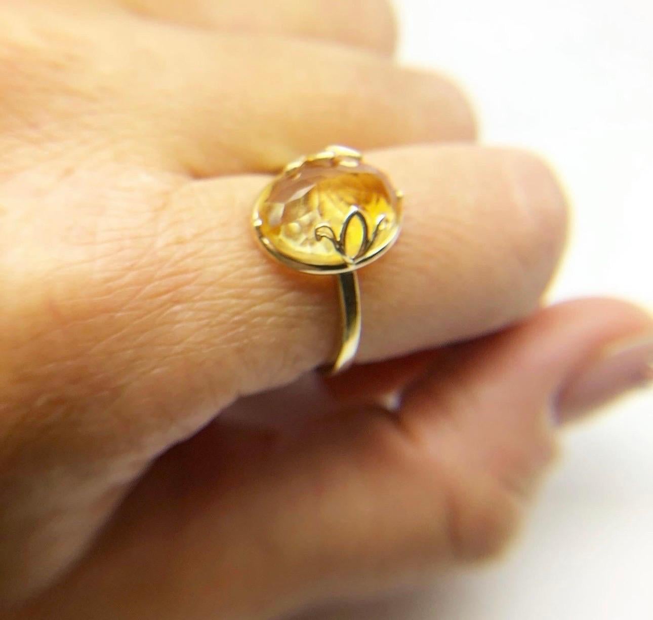 Cocktail ring with a large 4 carats citrine in an 18KT yellow gold setting completely open on the basket bottom, some believe that citrine has many gemstone power and the power will better be absorbed if the rings with large gemstones are open under