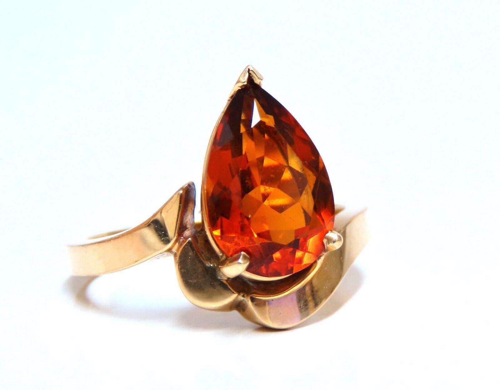 4ct Natural Pear shape Garnet ring.

10 x 7mm Garnet.

Clean clarity and transparent.

Dark orange color.

14kt yellow gold

4.2 grams

We may resize.