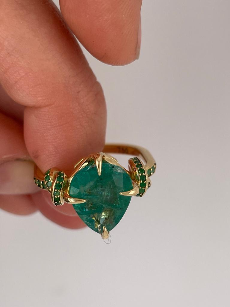 4ct pear cut emerald solitaire with emeralds in 18ct yellow gold 10