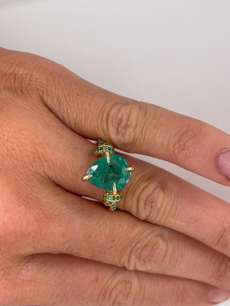 4ct pear cut emerald solitaire with emeralds in 18ct yellow gold 14