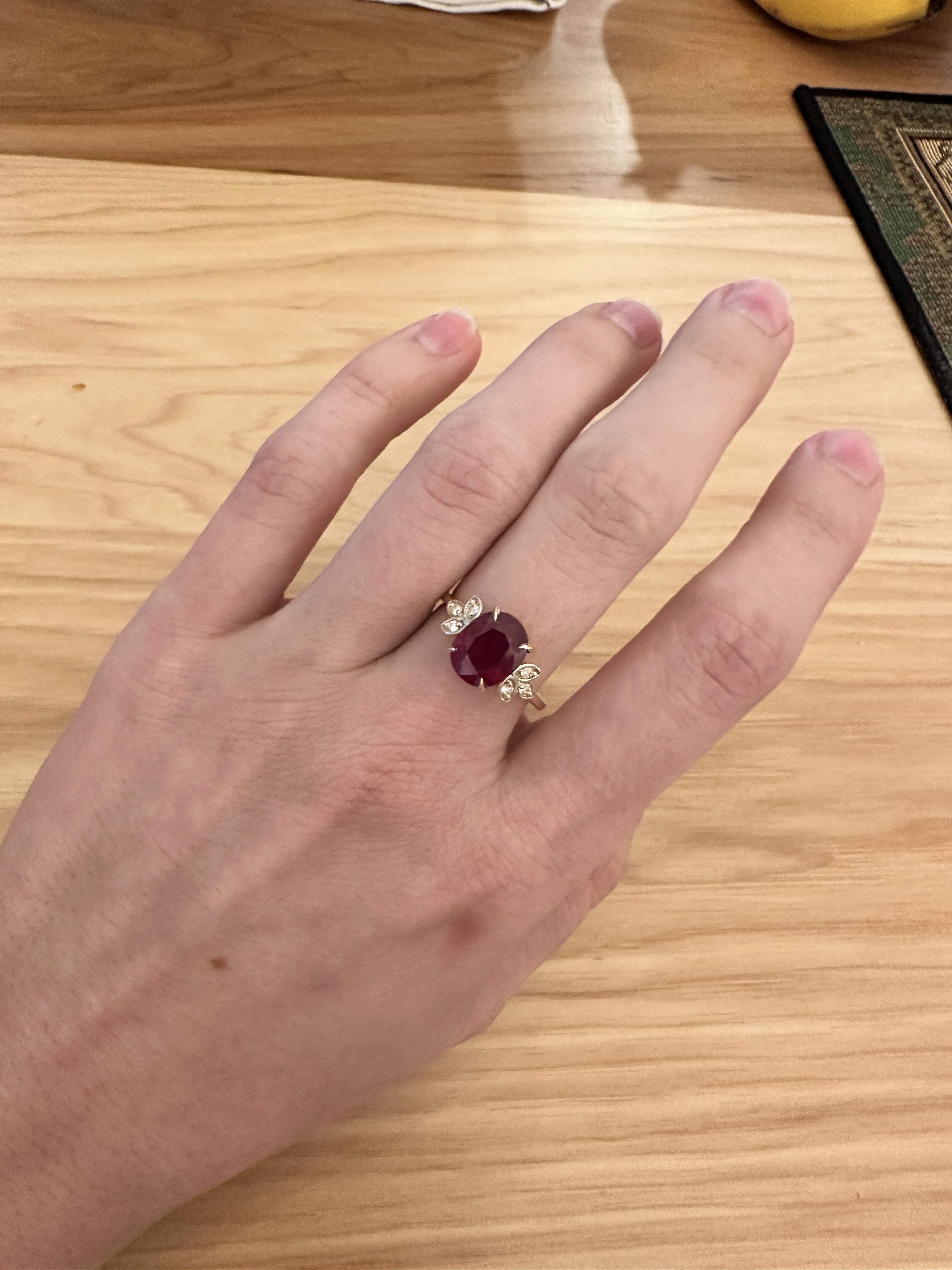 This beautiful ring features a 4.01 carat oval Ruby gemstone with natural earth mined diamonds set in solid 14K yellow gold. This Ruby ring makes a lovely July birthstone gift for your loved ones!

**We offer complimentary resizing, message us the
