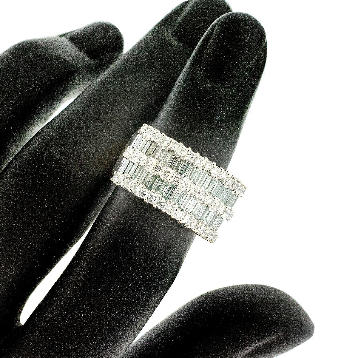 14k White Gold 4ctw Round & Baguette Diamond Wide Ring

When it comes to jewelry, there's nothing quite like the classic beauty of diamonds. If you're searching for a piece that captures the essence of timeless elegance and refined luxury, the 14k