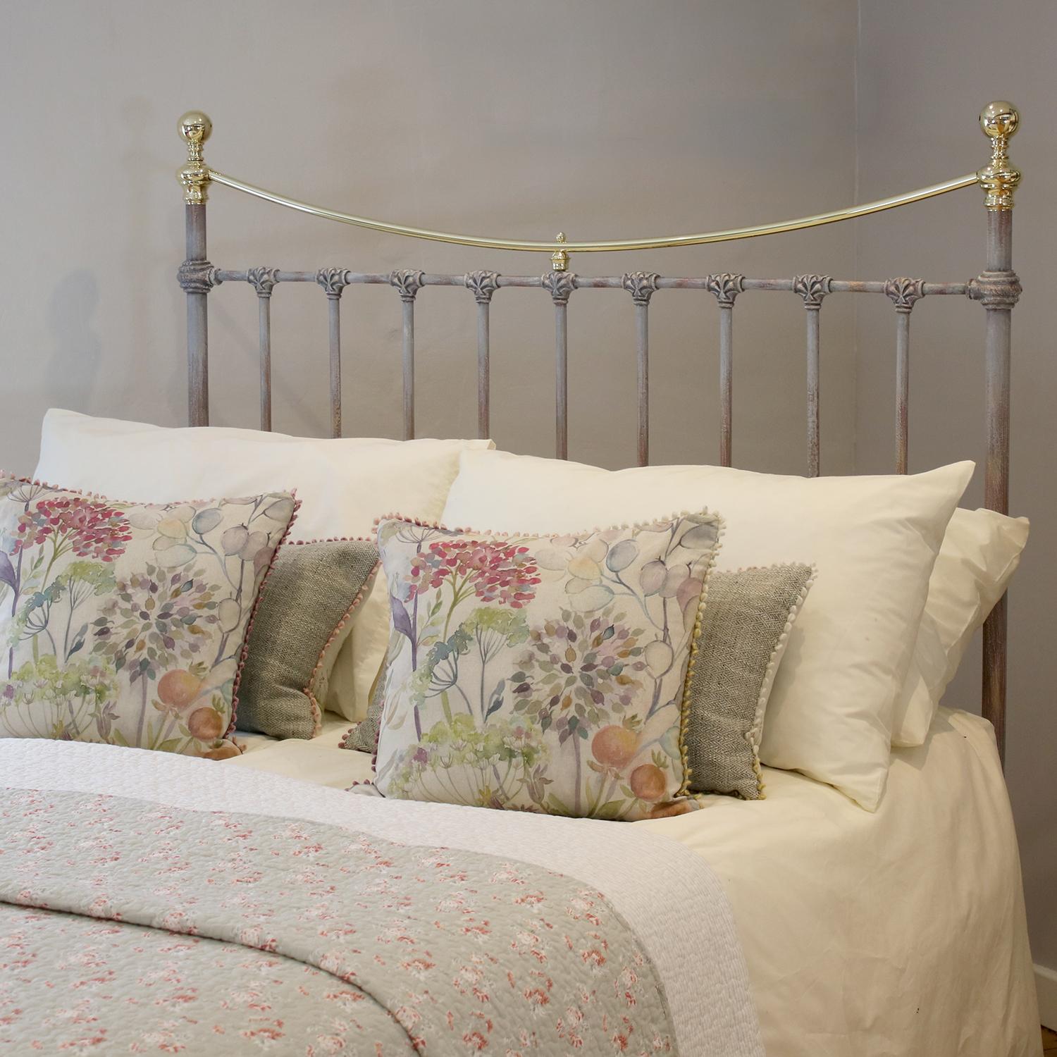 A platform brass and cast iron low end bed sympathetically adapted from an original frame. This bed has brass knobs and curved top rail finished in our hand painted finish.

The bed accepts a double size, 4ft 6in wide, base and mattress