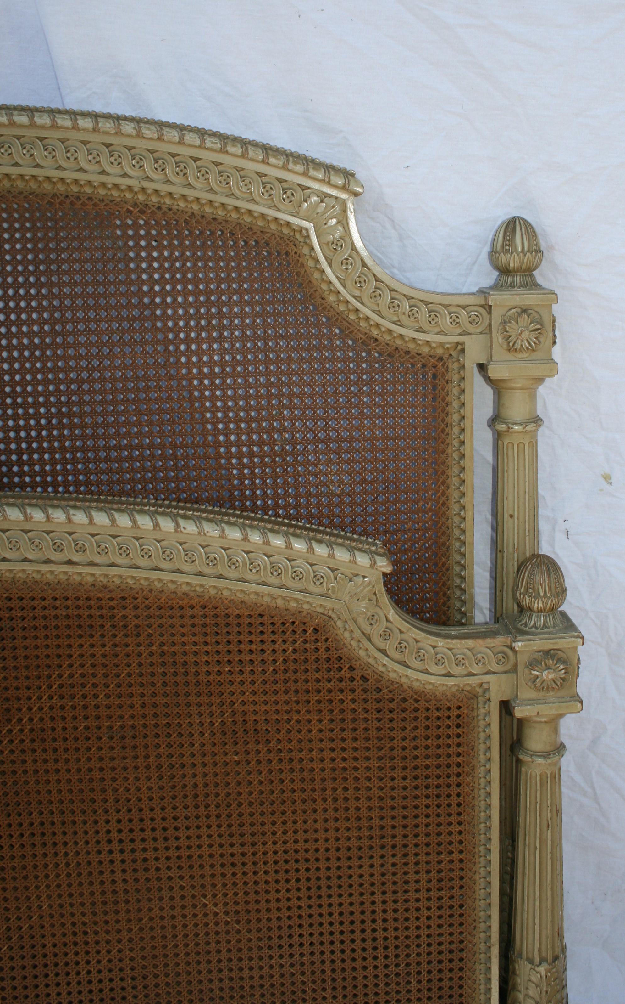 Caned and original paint small French bed, very well carved and in good condition with no damage to cane, mattress size 4ft by 6.3