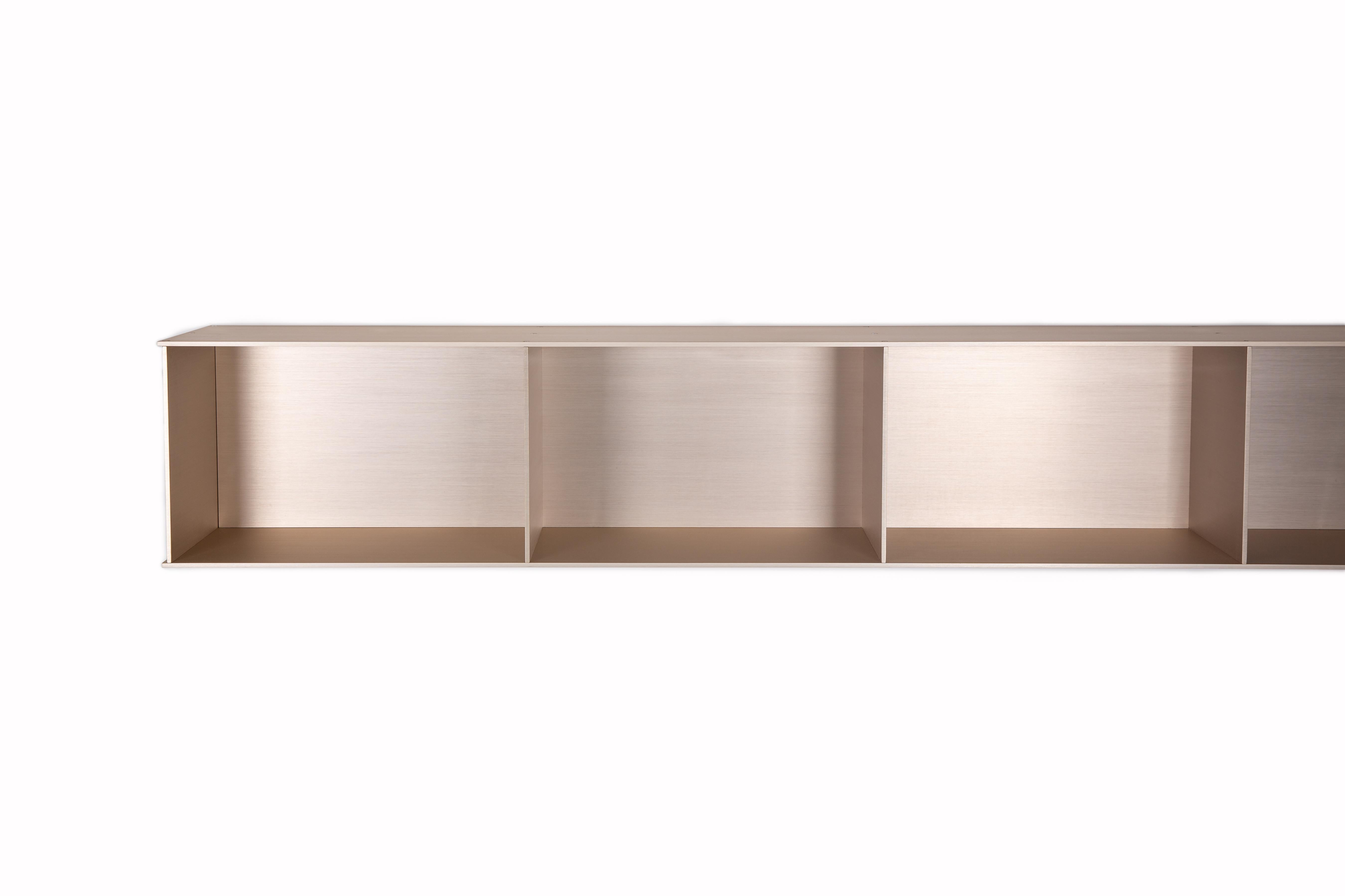 The Minimalist wall-mounted 4G shelf is sculpted out of 1/4 inch thick, brushed and anodized. Each shelf has an inset bolted U-channel that spans the length of the shelf and easily mounts on included custom-bent steel Z-clips. Each bay of this