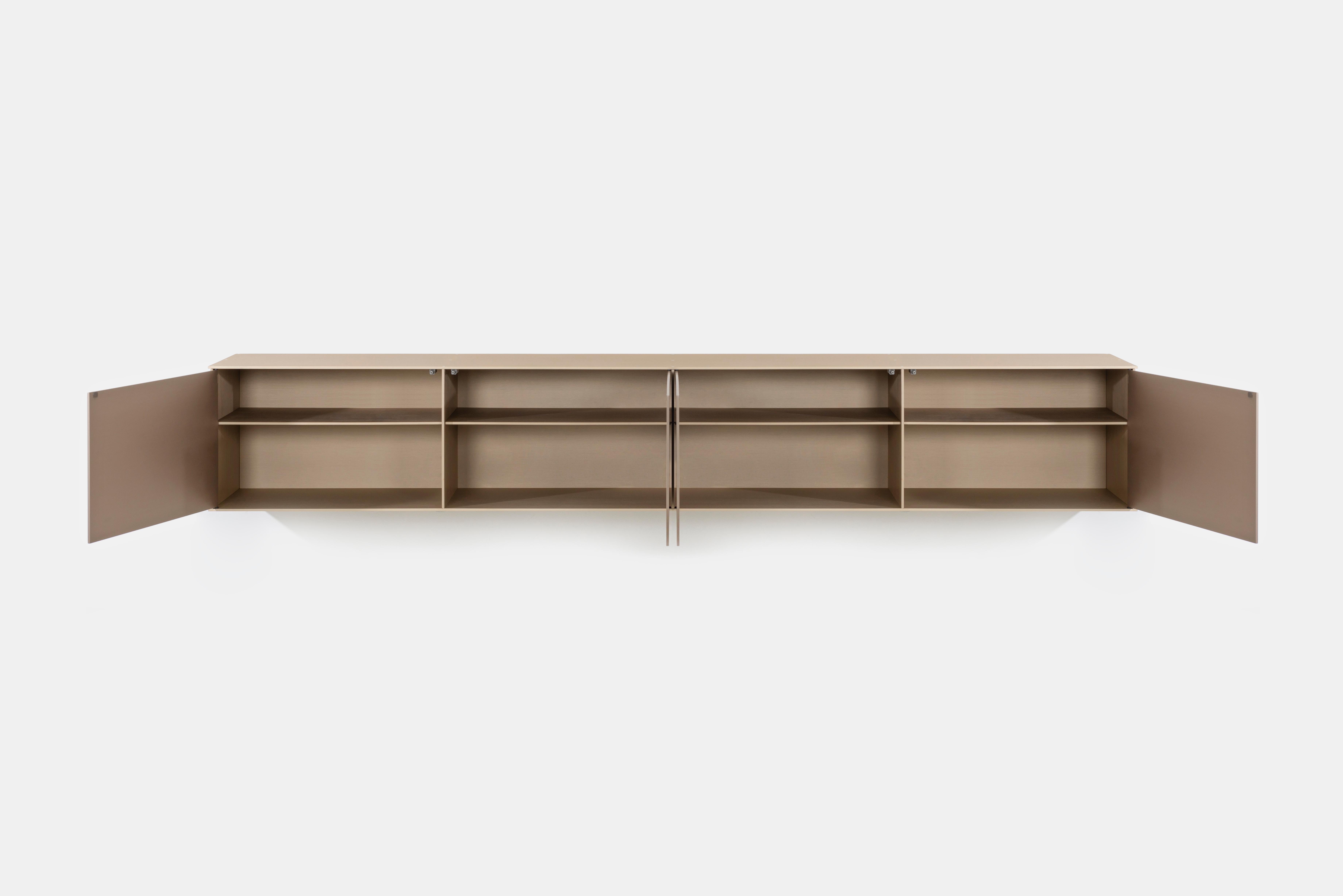 The minimalist wall-mounted 4G shelf is sculpted out of 1/4 inch thick, brushed and anodized. The shelf has an inset bolted U-channel that spans the length of the shelf and easily mounts on included custom-bent steel Z-clips. Each bay of this