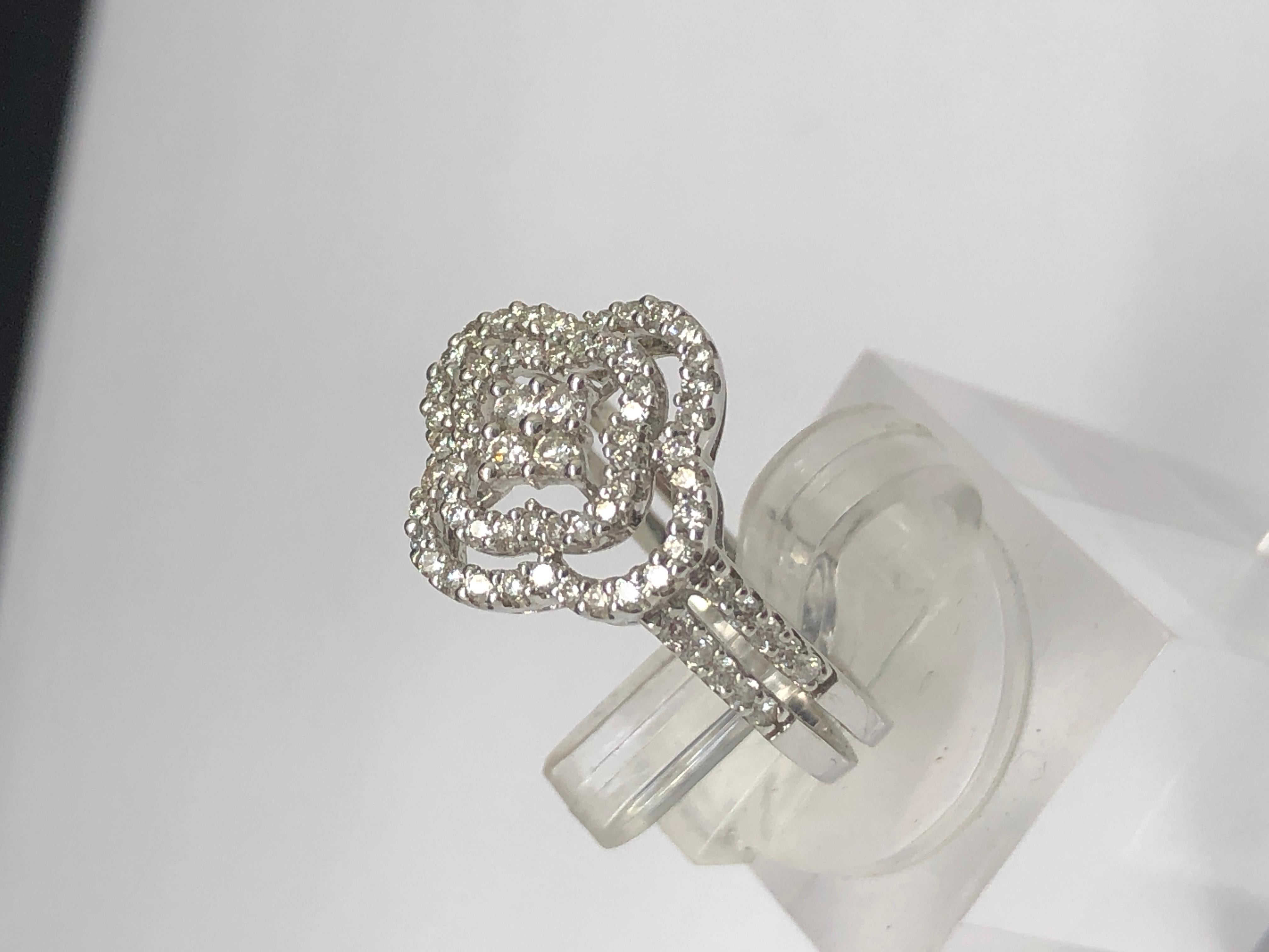 Up for sale:

This absolutely stunning solid 14k white gold round cut natural diamond clover ring. The ring is featuring 1.00ctw in round cut natural diamonds; F color; VS1 clarity; very good cut--Amazing life and brilliance!

These diamonds HAVE