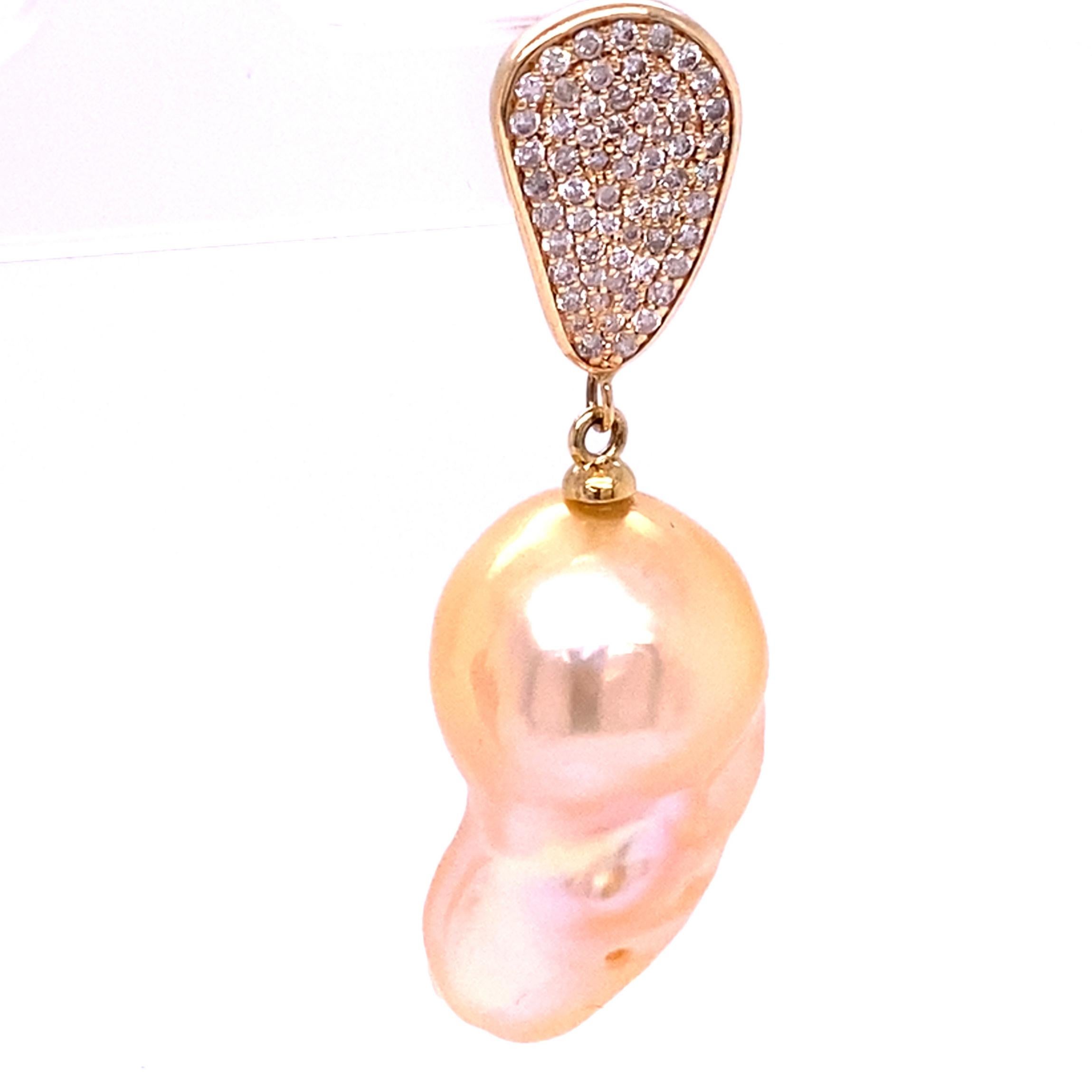 Amp up the glamour with these stunning Diamond Teardrop Natural Baroque Pearl Drop Earrings.

Featuring  hand selected  golden hued natural baroque earrings dangling from a highly polished  yellow gold Teardrop with 1.30ct of sparkling diamonds,