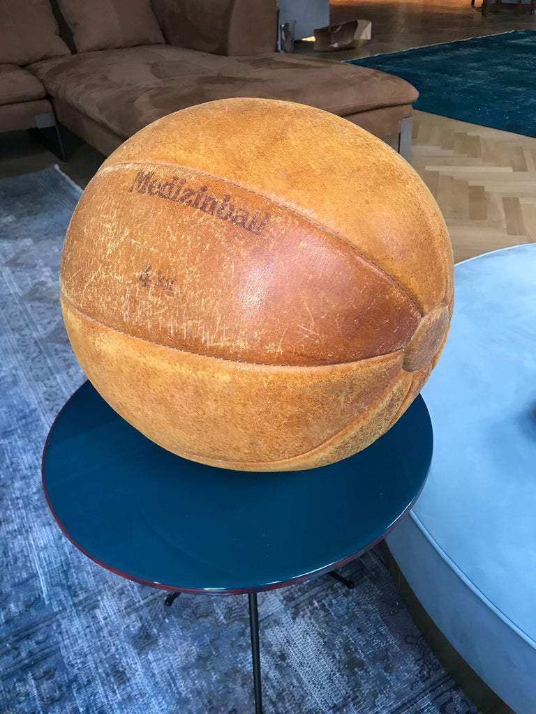 The medicine ball is part of a big collection from the 1920s-1930s, the time of the first gym enthusiasts in Germany. The ball is handmade and filled with horse hair. All balls are in a very good condition with nice patina and an intense color.