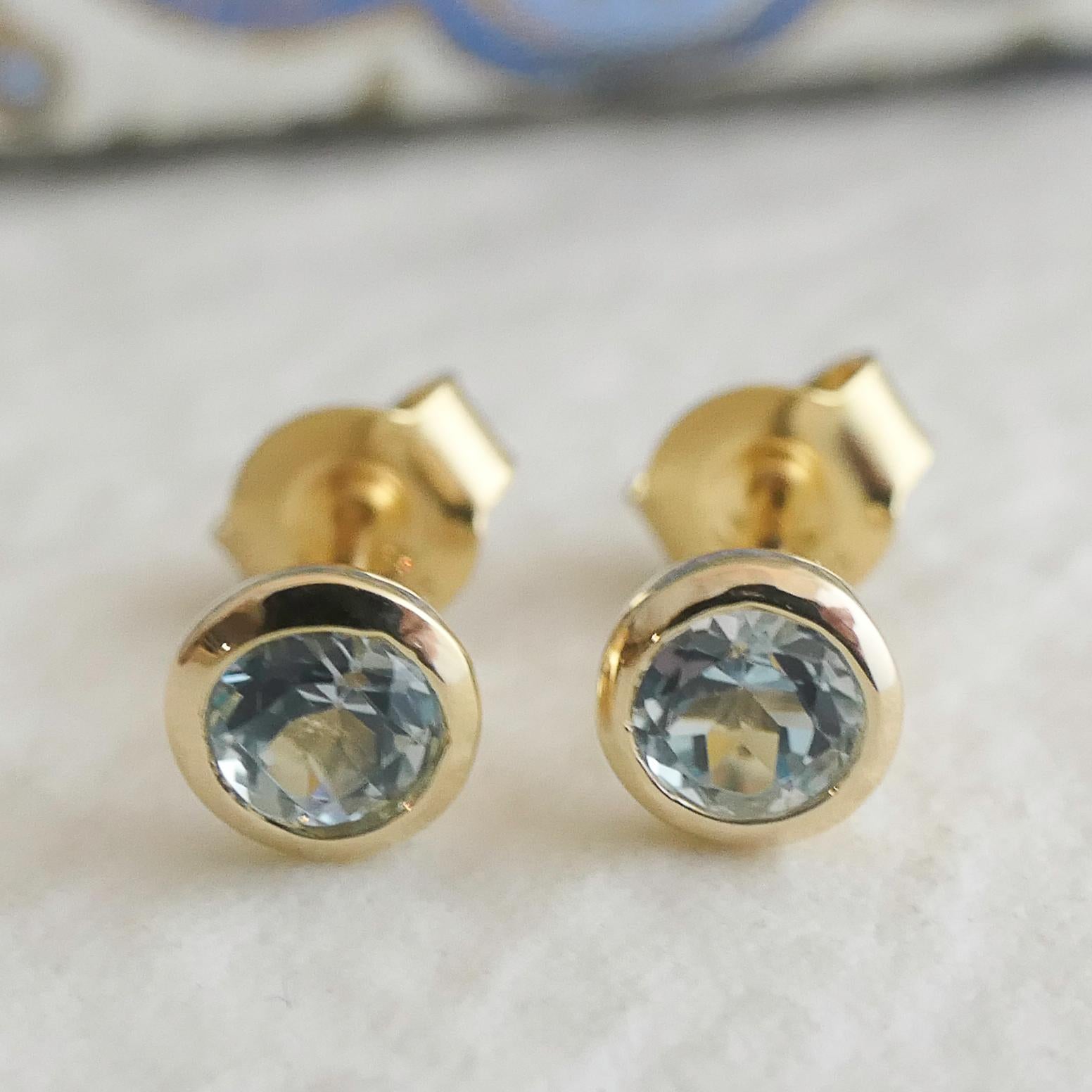 Women's 4mm Blue Topaz Gold Plated Sterling Silver Stud Earrings For Sale