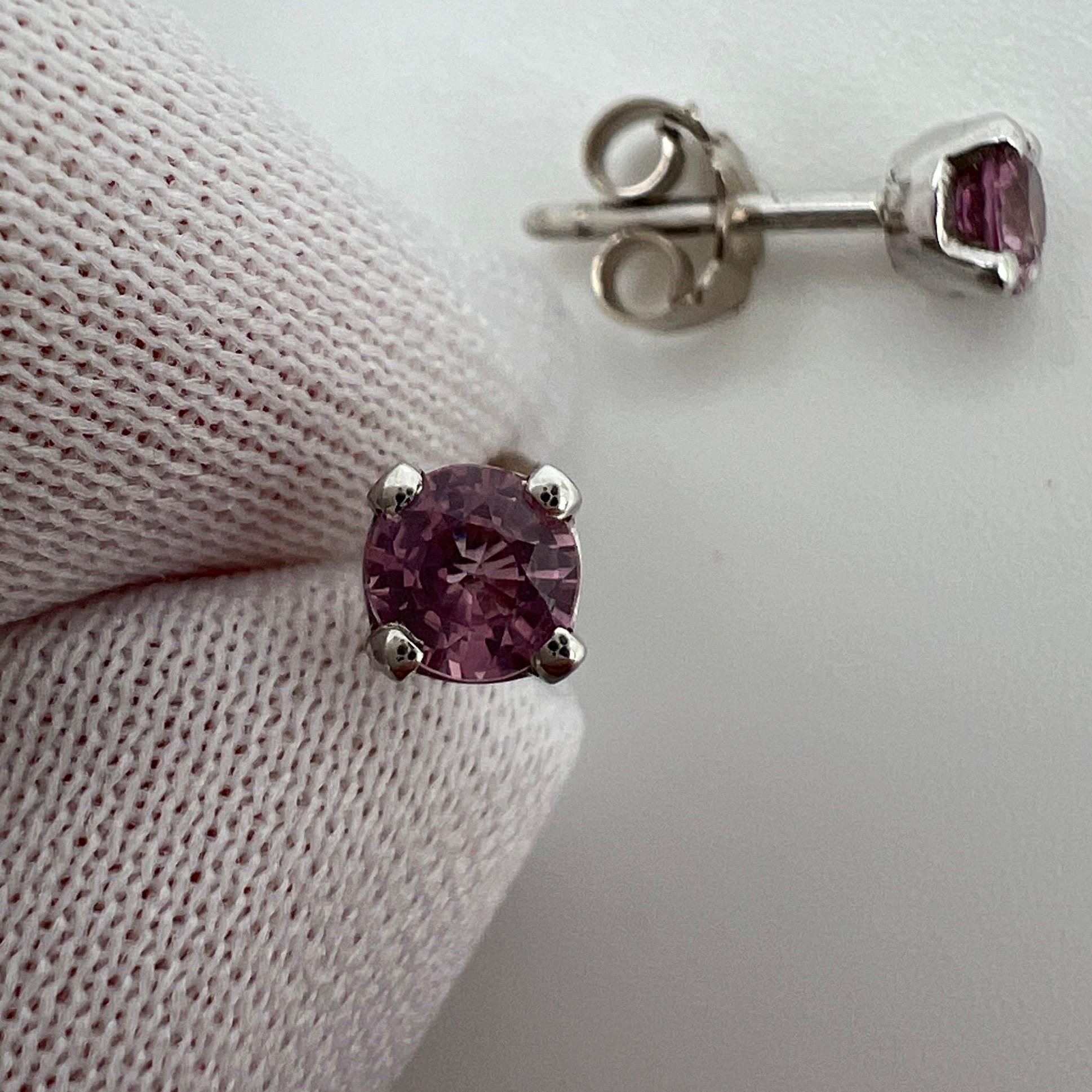 0.60ct Natural Vivid Pink Sapphires 18K White Gold Round Cut Earring Studs.

Stunning natural 4mm vivid pink sapphires in 18k white gold studs.
0.60 total carat, perfect matching pair. 

Both have a beautiful vibrant colour and very good clarity.