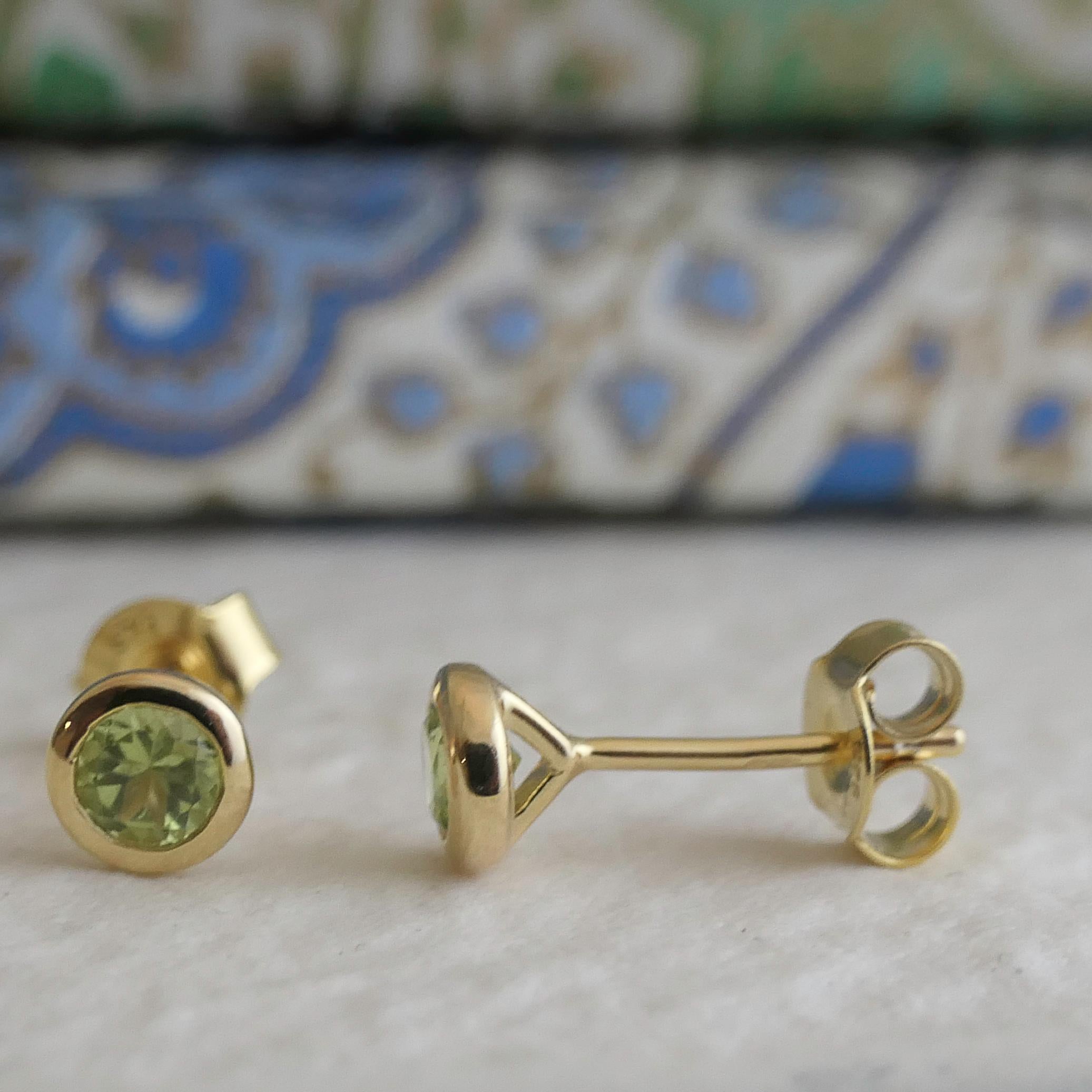 4mm faceted round peridot is set in gold plated sterling silver. Diameter for earrings are approximately 5mm. 