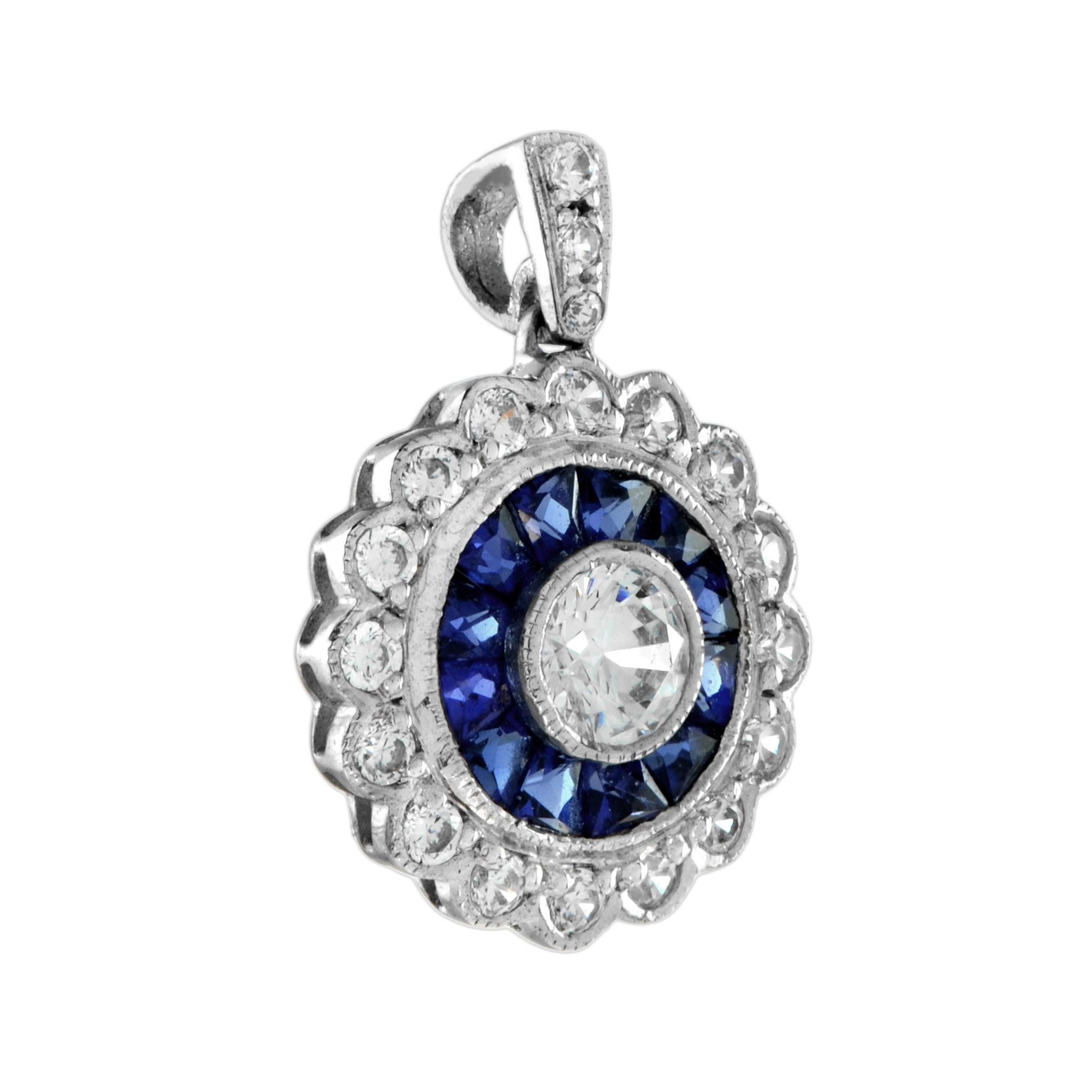 A glamorous pair of Art Deco-inspired target pendant bezel set with a round brilliant cut diamond in the center. The diamond weighs approx. 0.1 carat and its haloed by French cut sapphires and further diamonds set in gold with millgrain edging. 14K