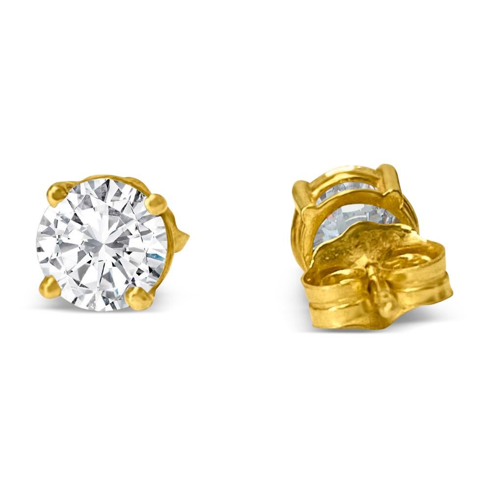 Crafted from lustrous 14k yellow gold, these exquisite unisex diamond studs feature 4mm round brilliant cut diamonds totaling 0.50 carats. With VVS-VS clarity and H-I color, these natural earth-mined diamonds are set in a classic 4-prong style,