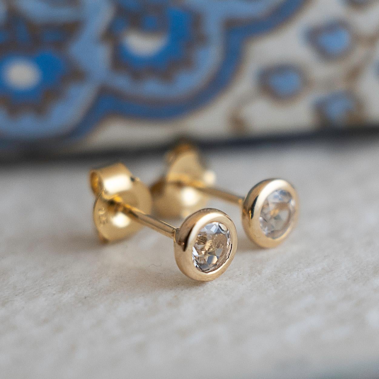 Women's 4mm White Topaz Gold Plated Sterling Silver Stud Earrings For Sale