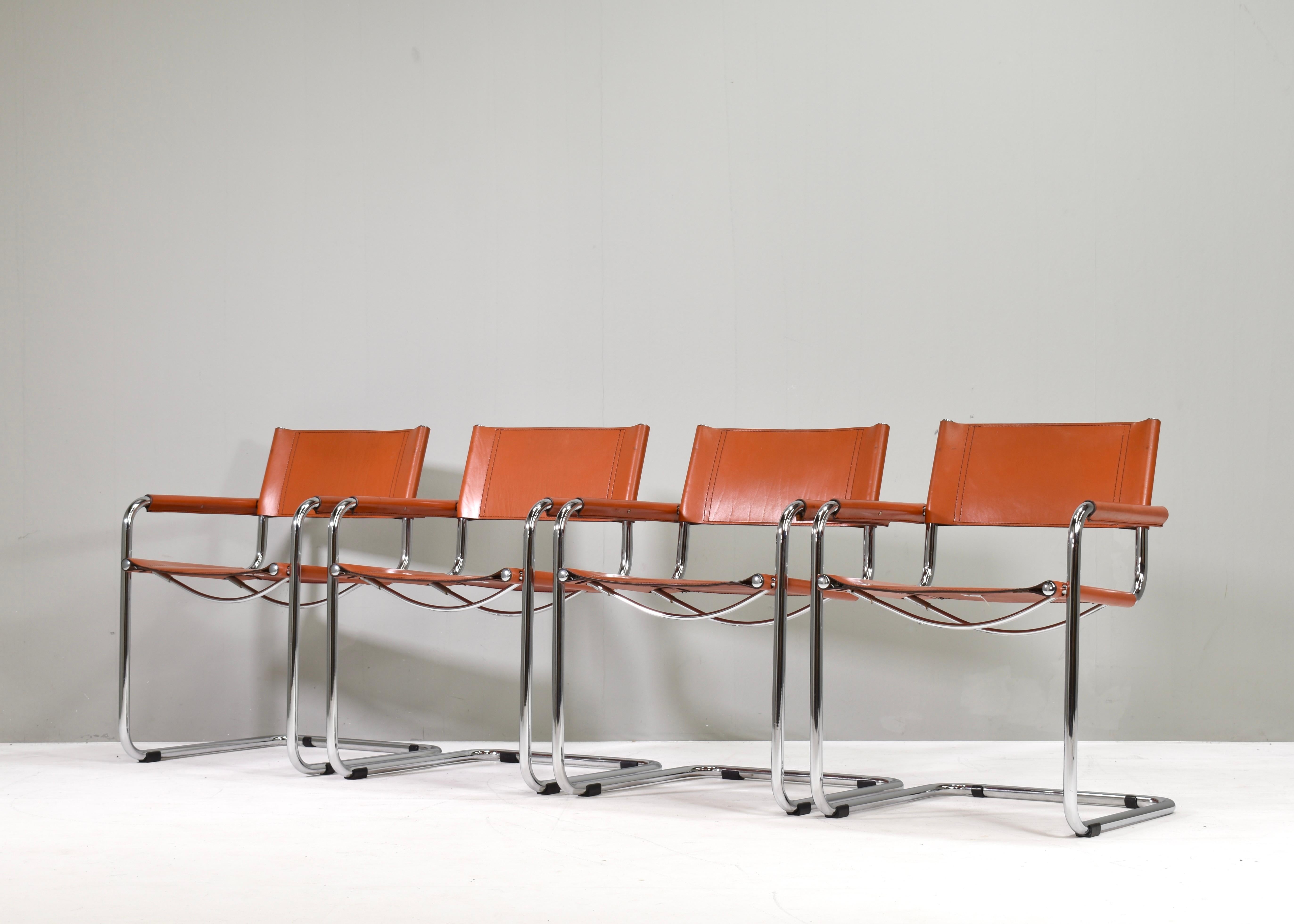 Set of six very comfortable Mart Stam S34 dining armchairs by Fasem – Italy, circa 1960. Rare find in a set of 6 with original tan saddle leather.
The leather has a beautiful tan cognac colour with patina that only comes with age. 
All chairs still