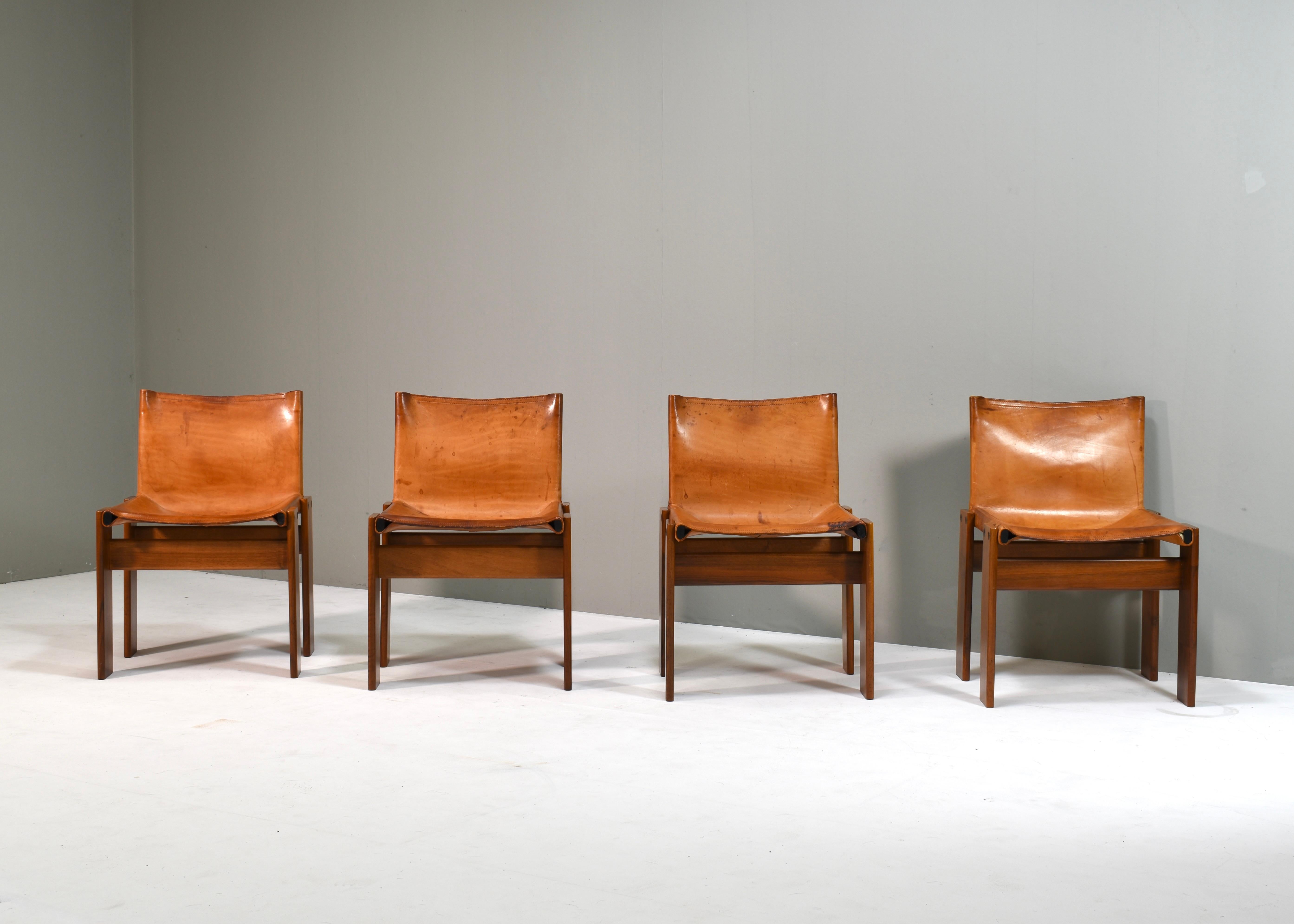 Set of four Monk chairs in patinated saddle leather and Italian Walnut by Afra and Tobia Scarpa for MOLTENI – Italy, 1974.
The leather has amazing patina which only comes with age. The leather still is strong and will last for years to come, no