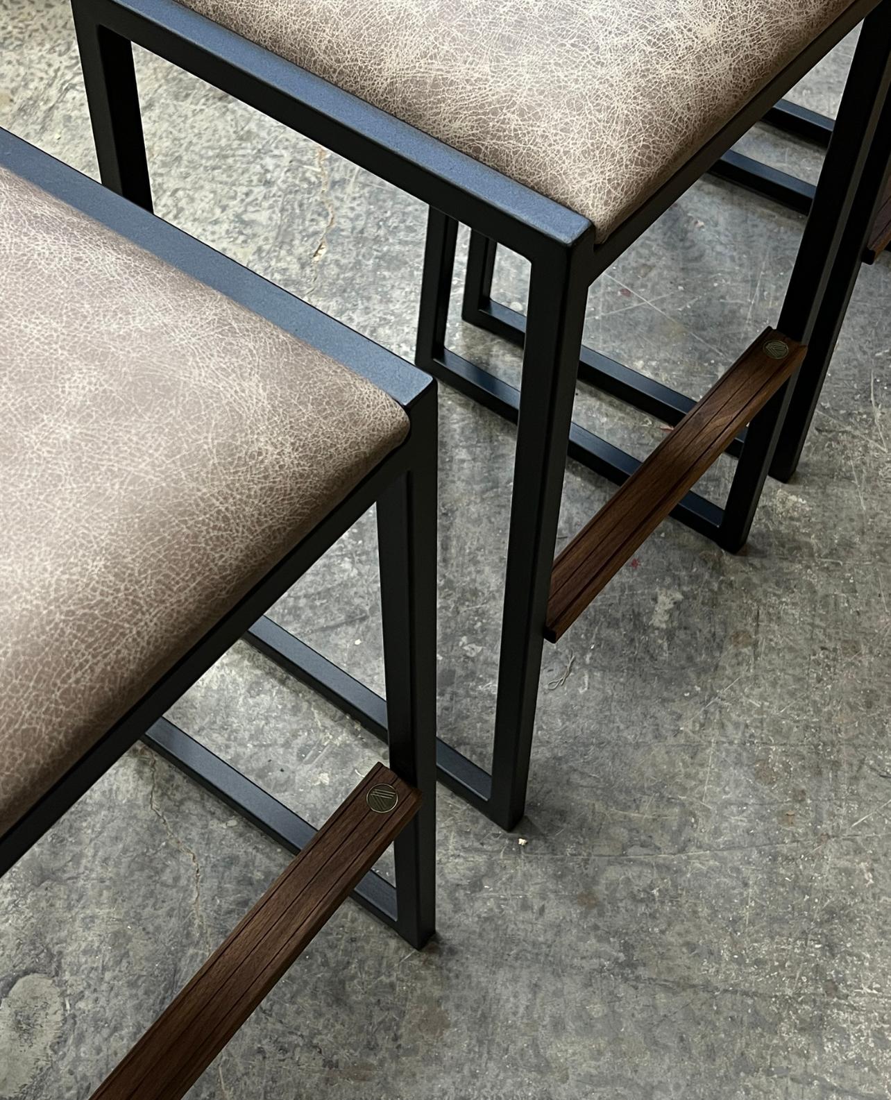 The shaker modern Backless Bar stool chair is handmade to order from our unique Ambrozia black textured steel tubing frame and a Genuine leather seat. Also offered in COM or COL. Inspired by the boarding ladder steps of an old boat. The anti-slip