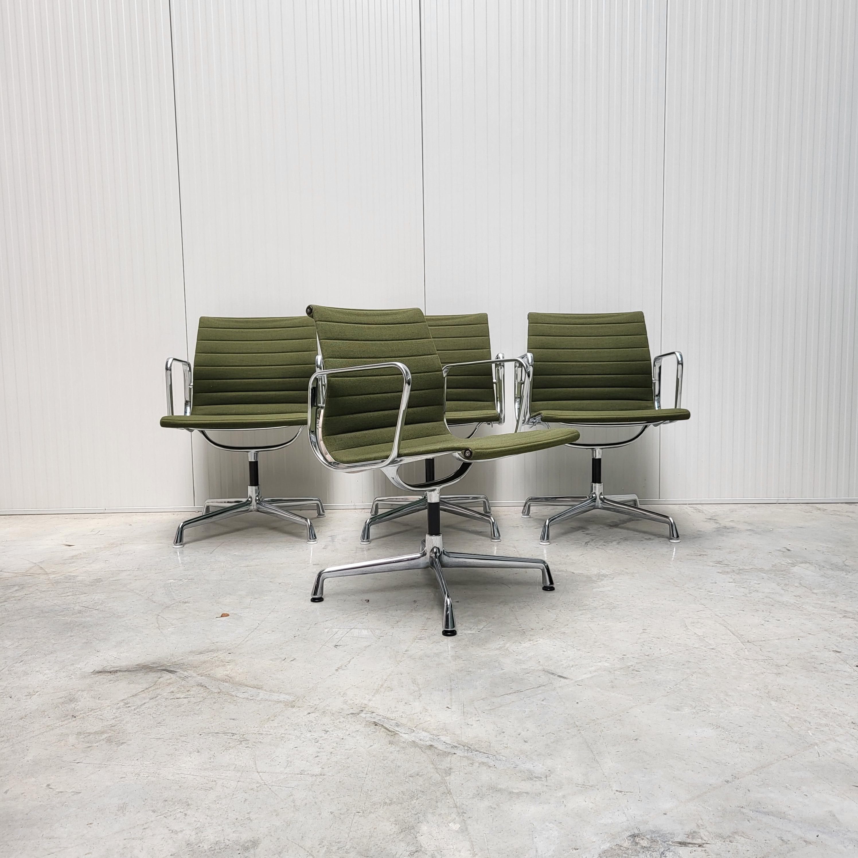 Nice set of 4 olive green Hopsak chairs model EA107 produced by Vitra. 
The chairs features a chromed aluminium frame and are all made in 1992.

The set is perfect useable in a dining or conference room.
The new retail price for a single chair is