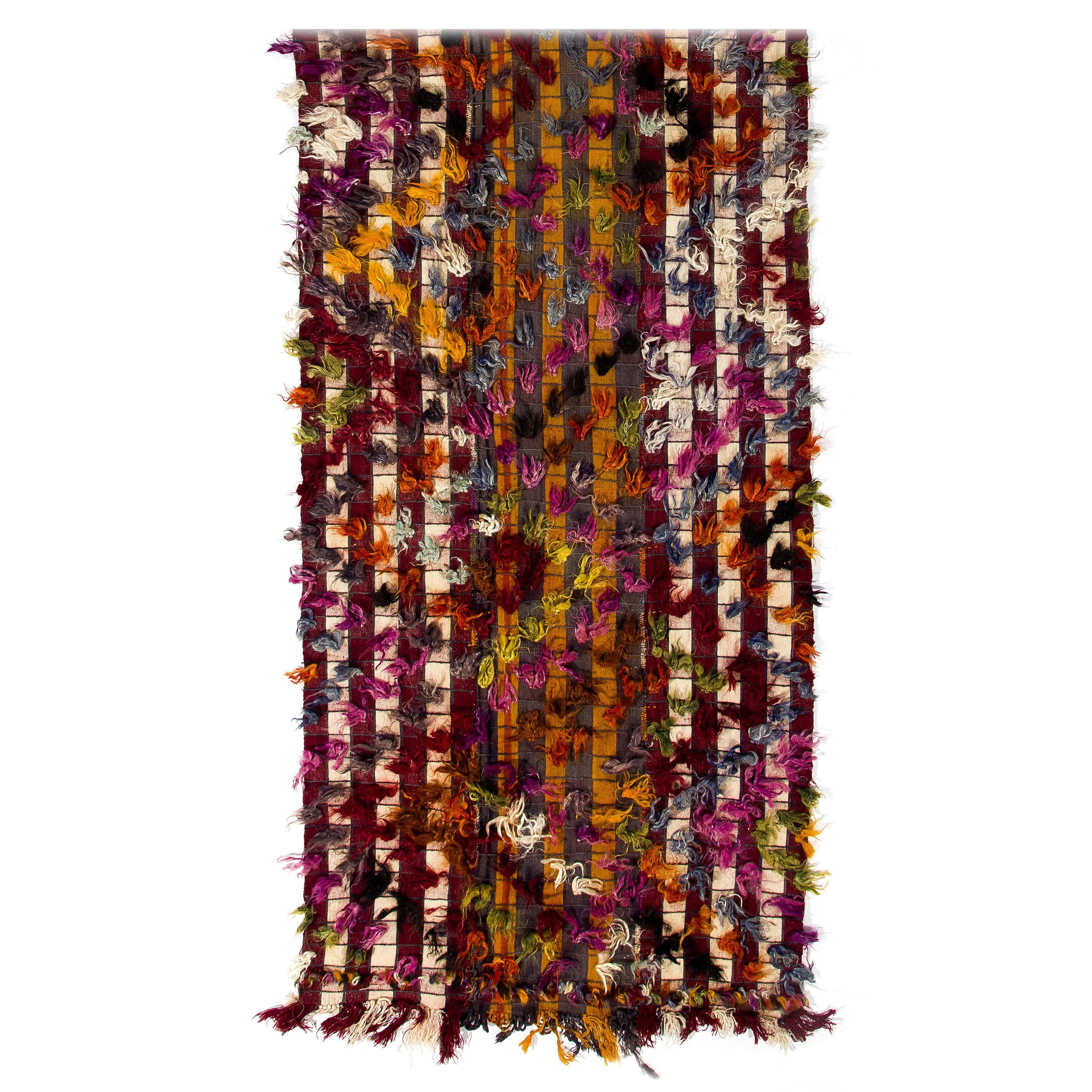 This lively handwoven rug was produced by Kurdish villagers in Central Turkey for daily use in third quarter of the 20th century. These splendid vintage weavings were used in various ways such as wall-hangings, bedding covers, tent dividers,