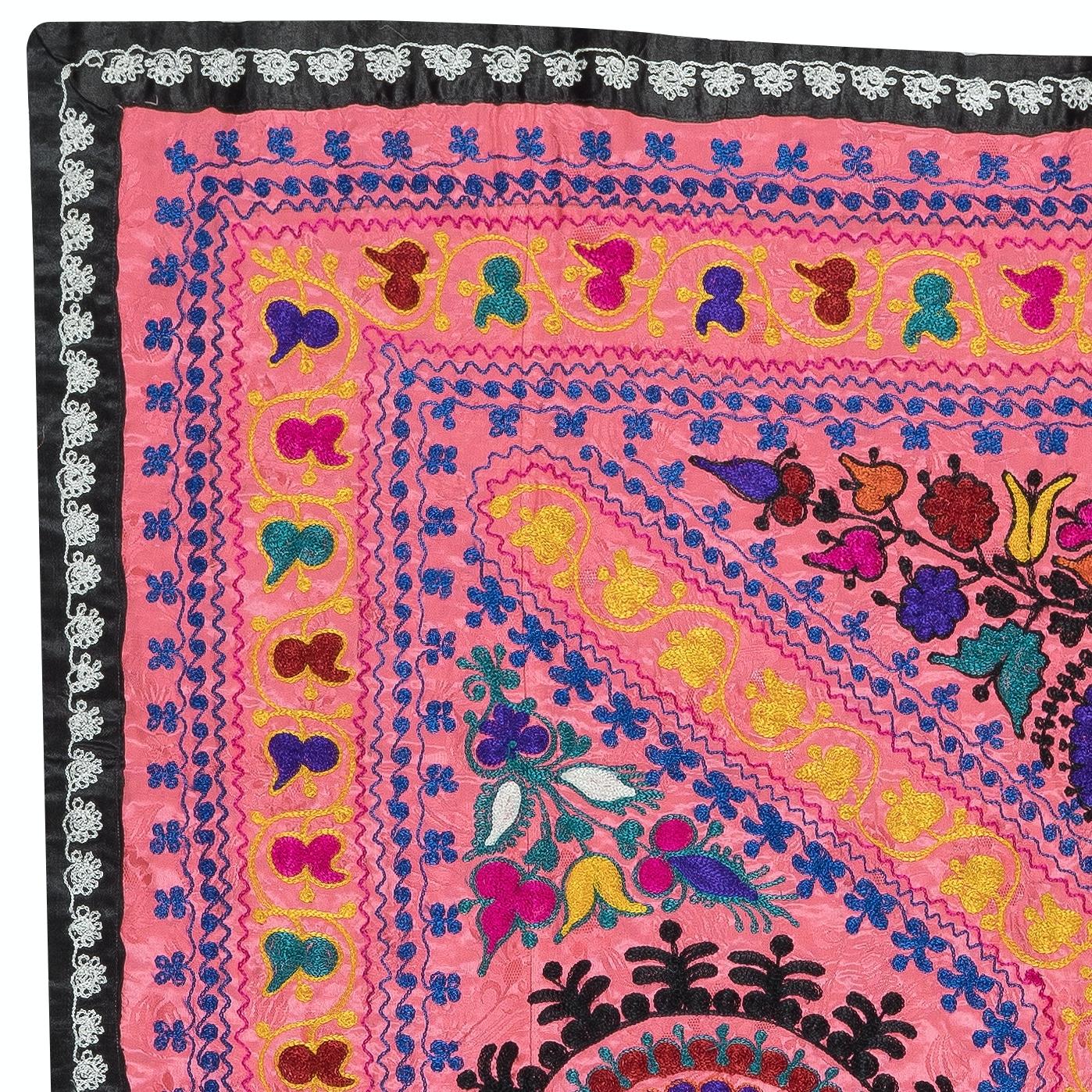 Introducing our exquisite new suzani hand embroidered wall hanging, a captivating piece that combines ancient craftsmanship with modern artistry. This embroidered cloth is not just a suzani throw, but a remarkable suzani wall hanging that will