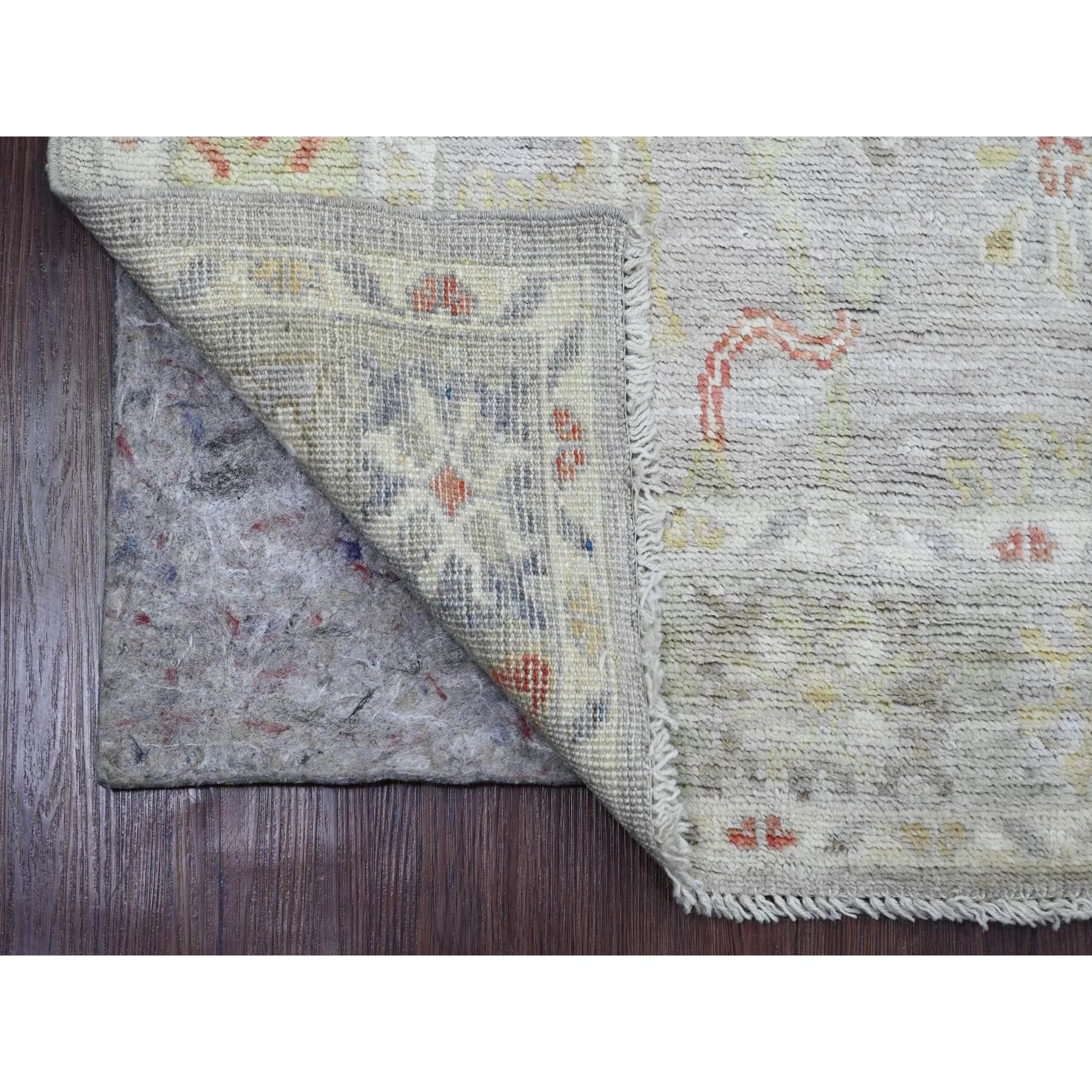 Cloud Gray, Hand Knotted, Afghan Angora Oushak with Colorful Leaf Design, Vegetable Dyes, 100% Wool, Oriental Rug
Primary materials: Wool
Latex: No Pile 
height: 0.25 Inches
Style: Transitional
Primary color: Grey
Secondary colors: Red, Yellow,