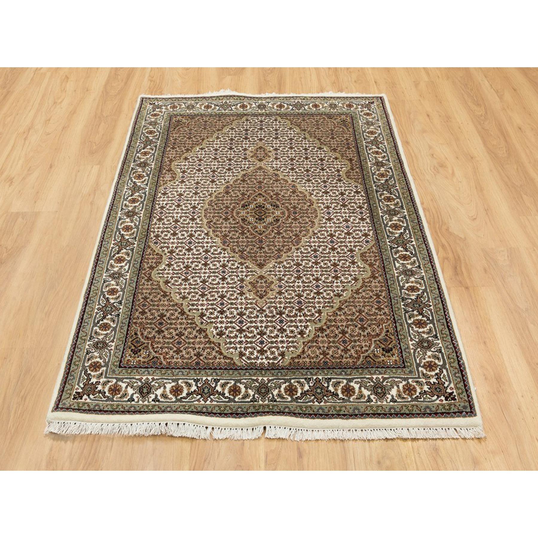 This is a truly genuine one-of-a-kind Hand Knotted Wool Ivory Fish Design Tabriz Mahi Oriental Rug. It has been Knotted for months and months in the centuries-old weaving craftsmanship techniques by expert artisans.
Primary materials: Wool
Latex: No