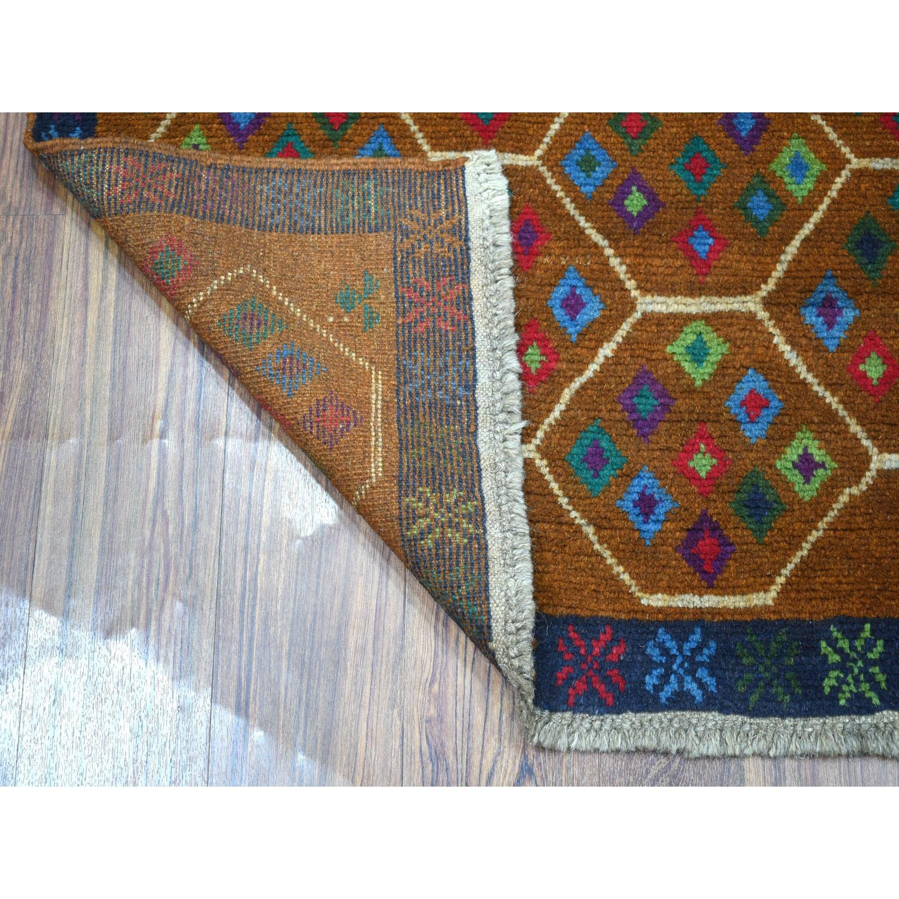 This is a truly genuine one-of-a-kind Brown Natural Dyes Colorful Afghan Baluch Tribal Design Hand Knotted 100% Wool Oriental Rug. It has been woven for months and months in the centuries-old Persian weaving craftsmanship techniques by expert
