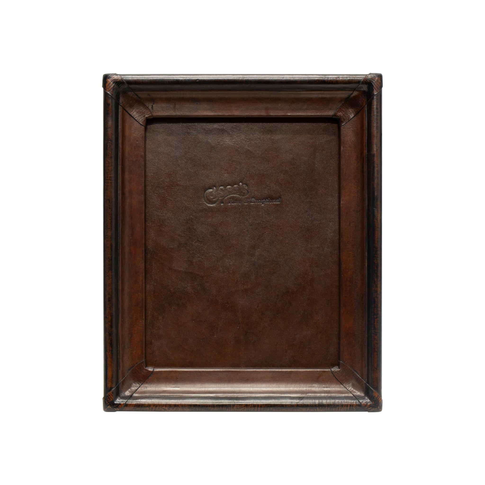 4x6 dark brown & black leather tabletop picture frame. Cisco's premium leather picture frames add the perfect accent to any home or office. Each frame is skillfully crafted by artisan saddle makers using genuine cowhide. Color: Dark brown with