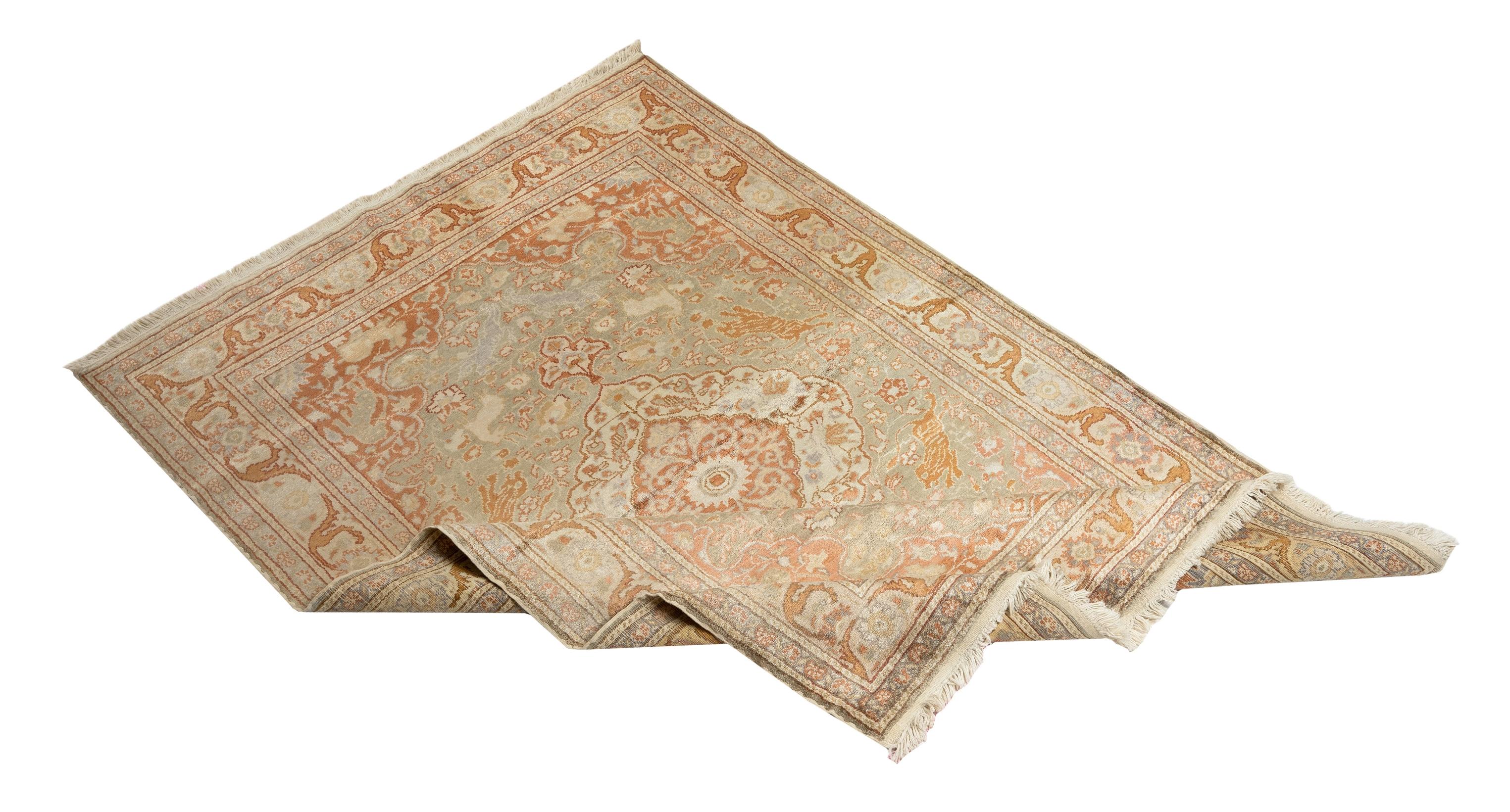 An elegant, very finely-woven Central Anatolian rug from the town of Kayseri made of art-silk that catches and reflects light with its beautiful, glowing, organic cotton-based material in a soft and soothing color palette of light tawny brown, sage