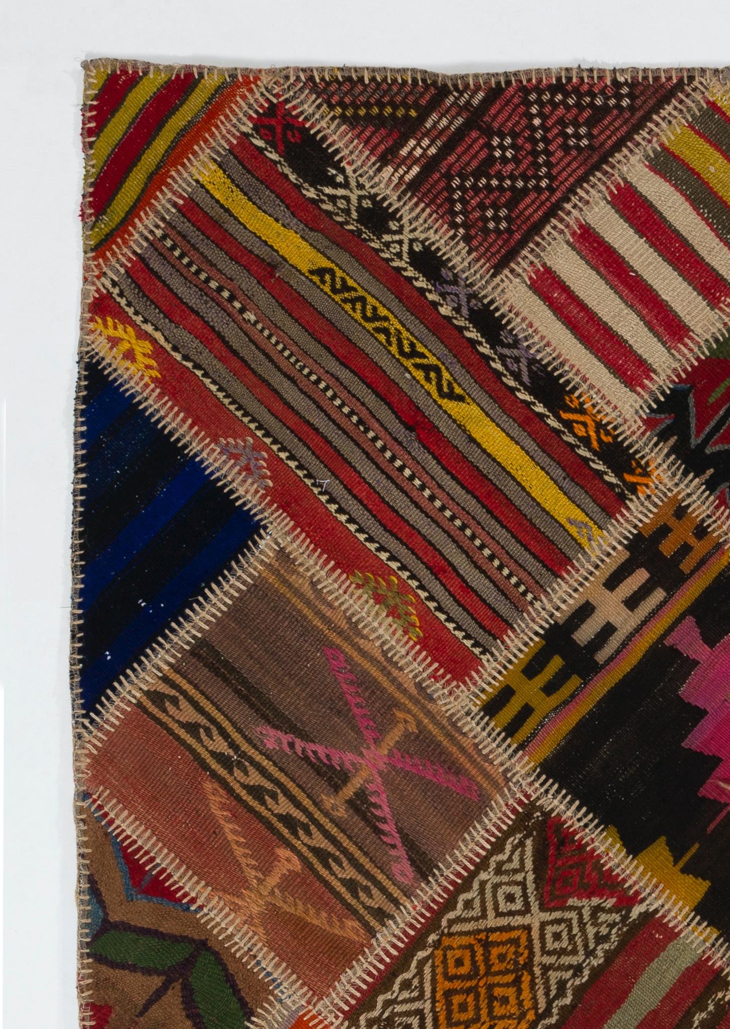 This patchwork rug is handmade from assorted pieces of vintage Turkish Kilims (flat-woven rugs), it is reinforced with a durable cotton twill/underlay stitched on the back for a smooth finish and extra thickness. 

The kilims used in making this rug
