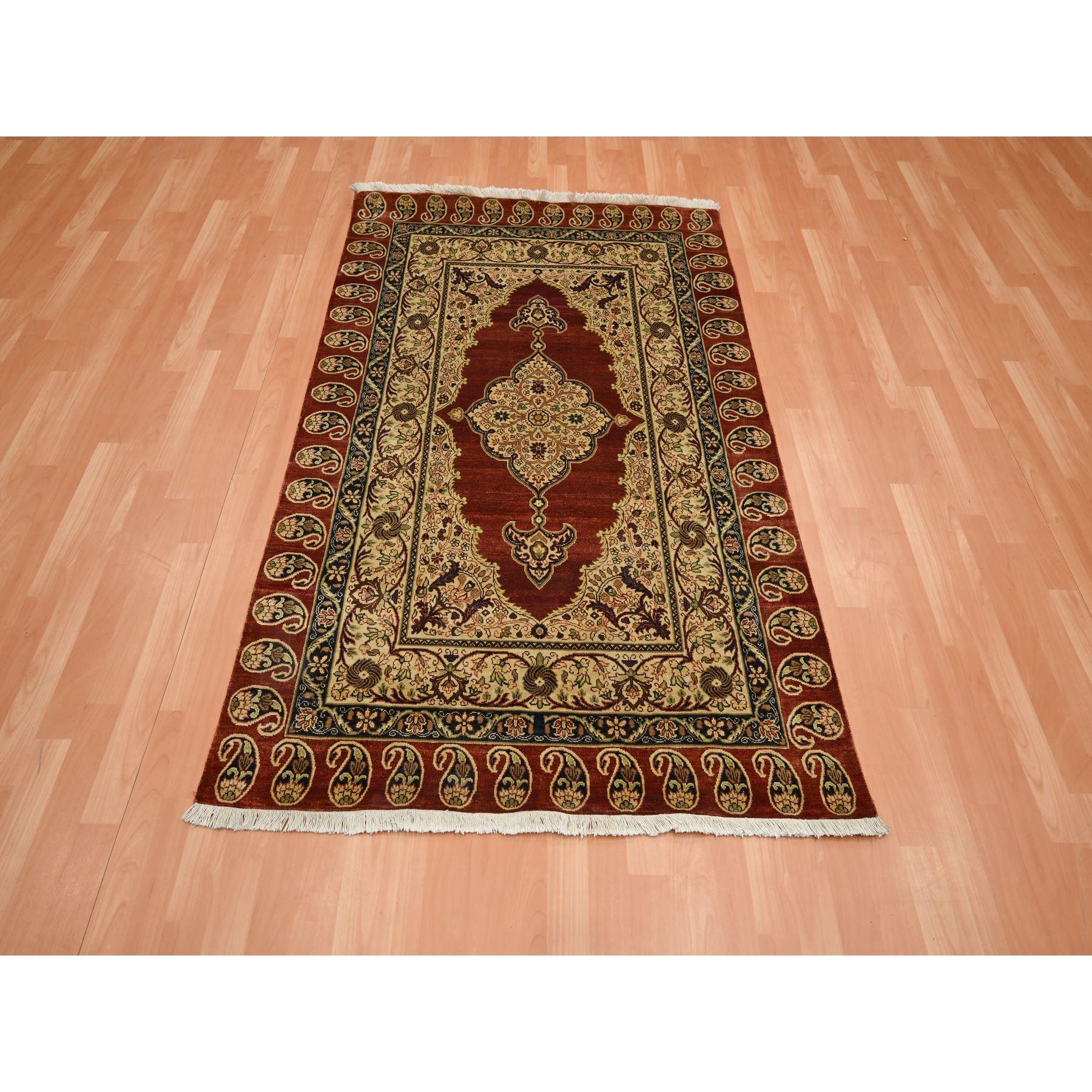 Wine Red, Pure Silk, Tabriz Haji Jalili Paisley Design, Hand Knotted, Soft Pile, Oriental Rug
Primary materials: Silk
Latex: No Pile 
height: 0.25 Inches
Style: Traditional
Primary color: Red
Secondary colors: Midnight Blue, Green, Ivory,