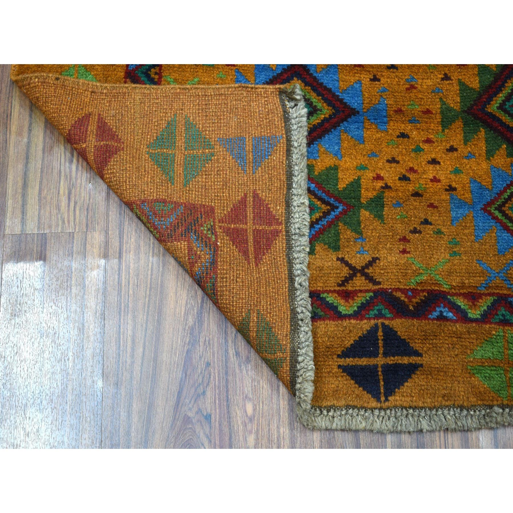 This is a truly genuine one-of-a-kind Natural Dyes Colorful Afghan Baluch Geometric Design Hand Knotted Pure Wool Oriental Rug. It has been woven for months and months in the centuries-old Persian weaving craftsmanship techniques by expert