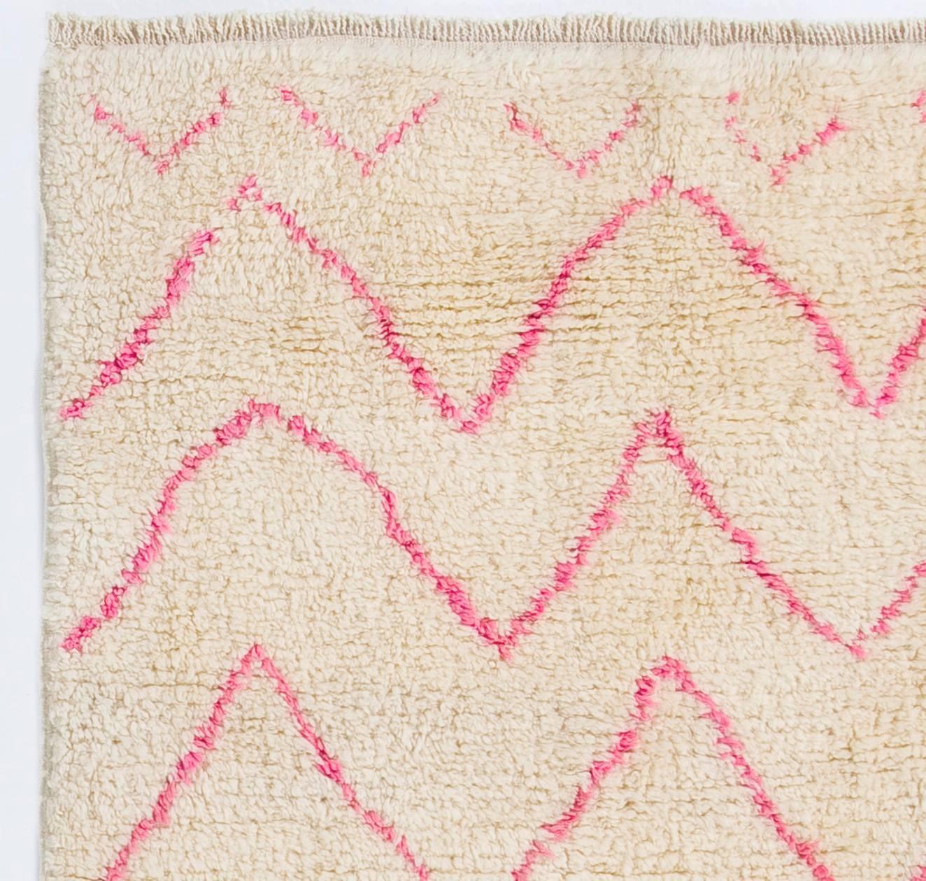 A contemporary hand-knotted Moroccan rug, made of lambswool. 
Thick and soft pile that is ideal for families with kids. 

The rug can be custom produced in a different size, color combination, any pattern and weave any design in approximately 5