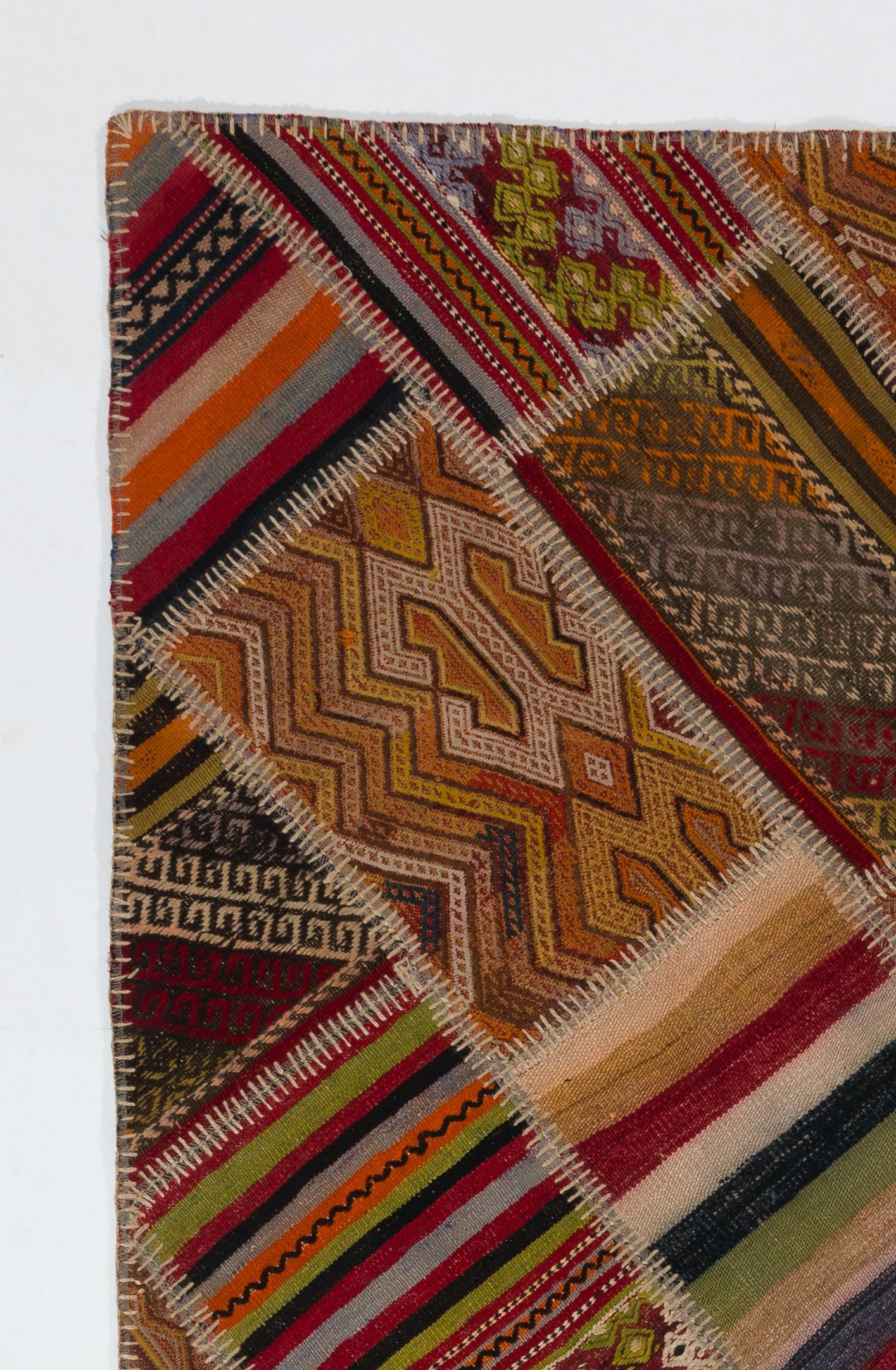 This Patchwork rug is hand-made from assorted pieces of vintage Turkish Kilims (flat-woven rugs), it is reinforced with a durable cotton twill/underlay stitched on the back for a smooth finish and extra thickness. Measures:4 x 6.3 ft.

The banded