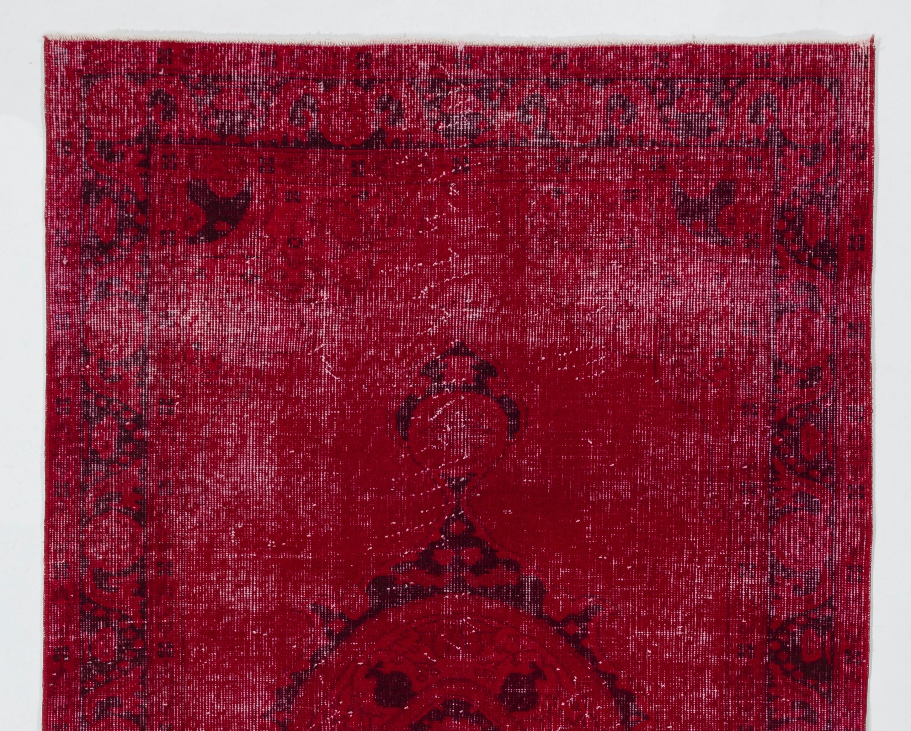 A vintage Turkish area rug over-dyed in red color. The rug is finely hand-knotted, has low wool pile on cotton foundation. It is in very good condition, professionally washed, sturdy and suitable for areas with high foot traffic.  

Size: 4x6.6 ft.