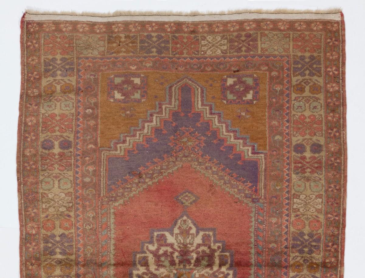 Vintage Turkish accent rug with soft medium wool pile on wool foundation. Hand-knotted in Turkey in the 1950s featuring a geometric medallion design. The rug is in good condition, sturdy and clean as a brand new rug. It can be used in a high-traffic
