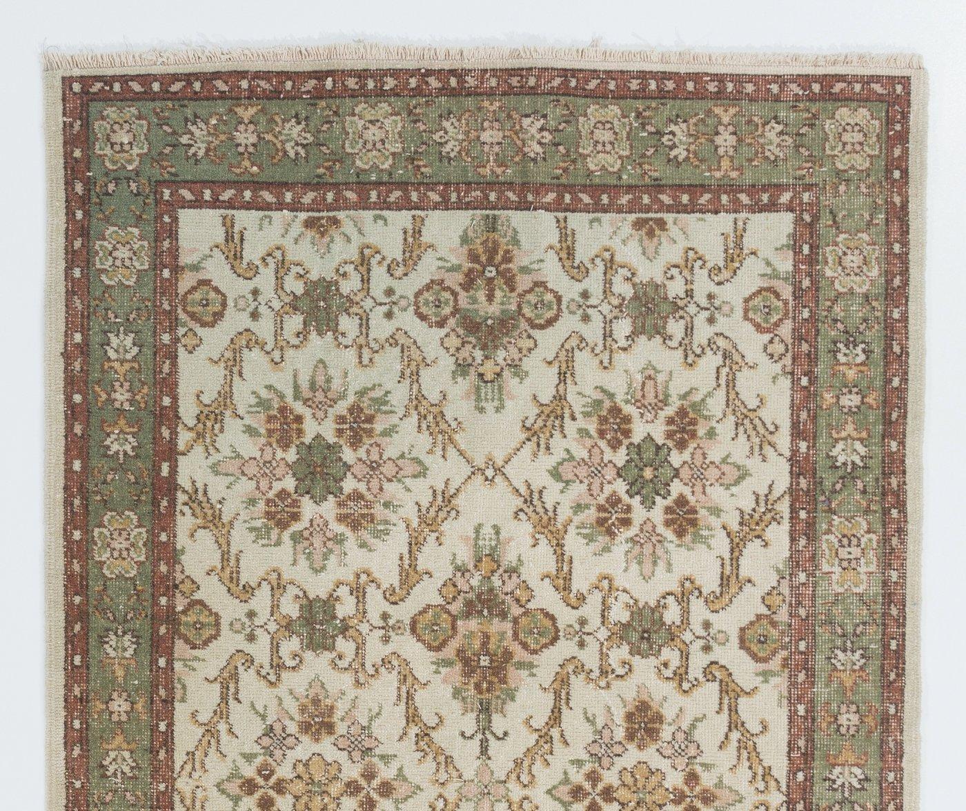 A vintage rug from Central Turkey. Finely hand-knotted with even medium wool pile on cotton foundation. Very good condition. Sturdy and as clean as a brand new rug (deep washed professionally). Measure: 4x6.8 Ft.
 