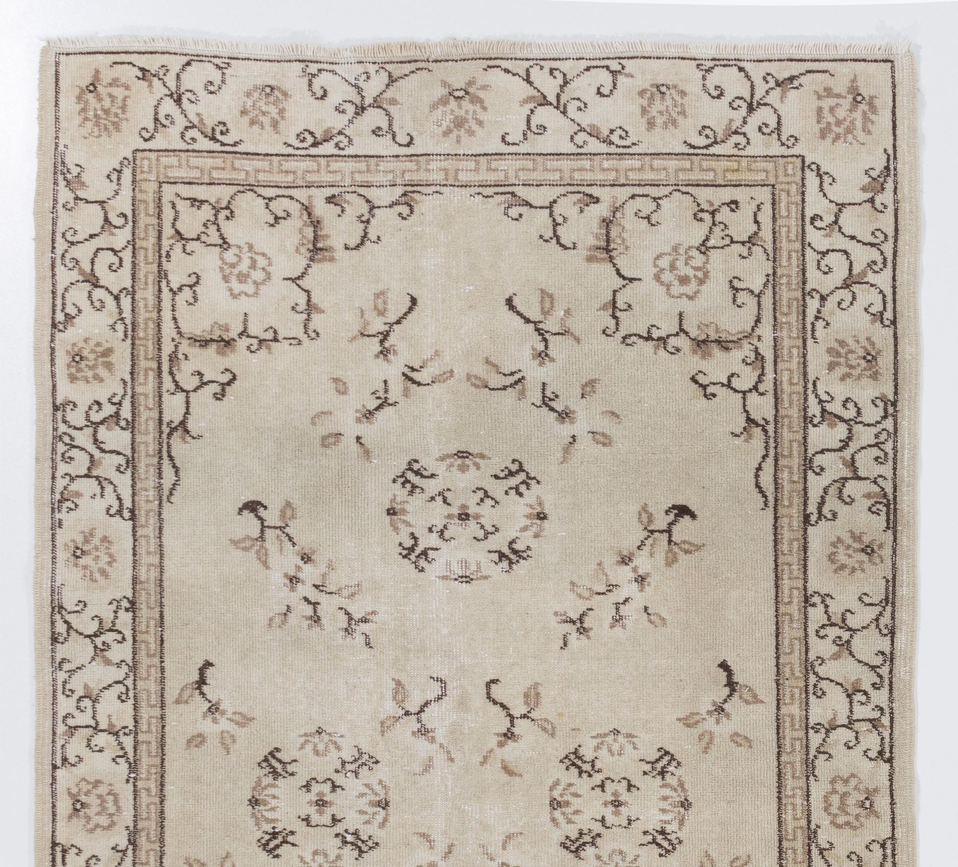 Art Deco Chinese design rug in beige, brown, taupe colors. Measure: 4 x 7 ft.

The brown outlines of rosettes as well as the meandering brown lines running through angular leaves all across the outer border are emphasized against a more softer