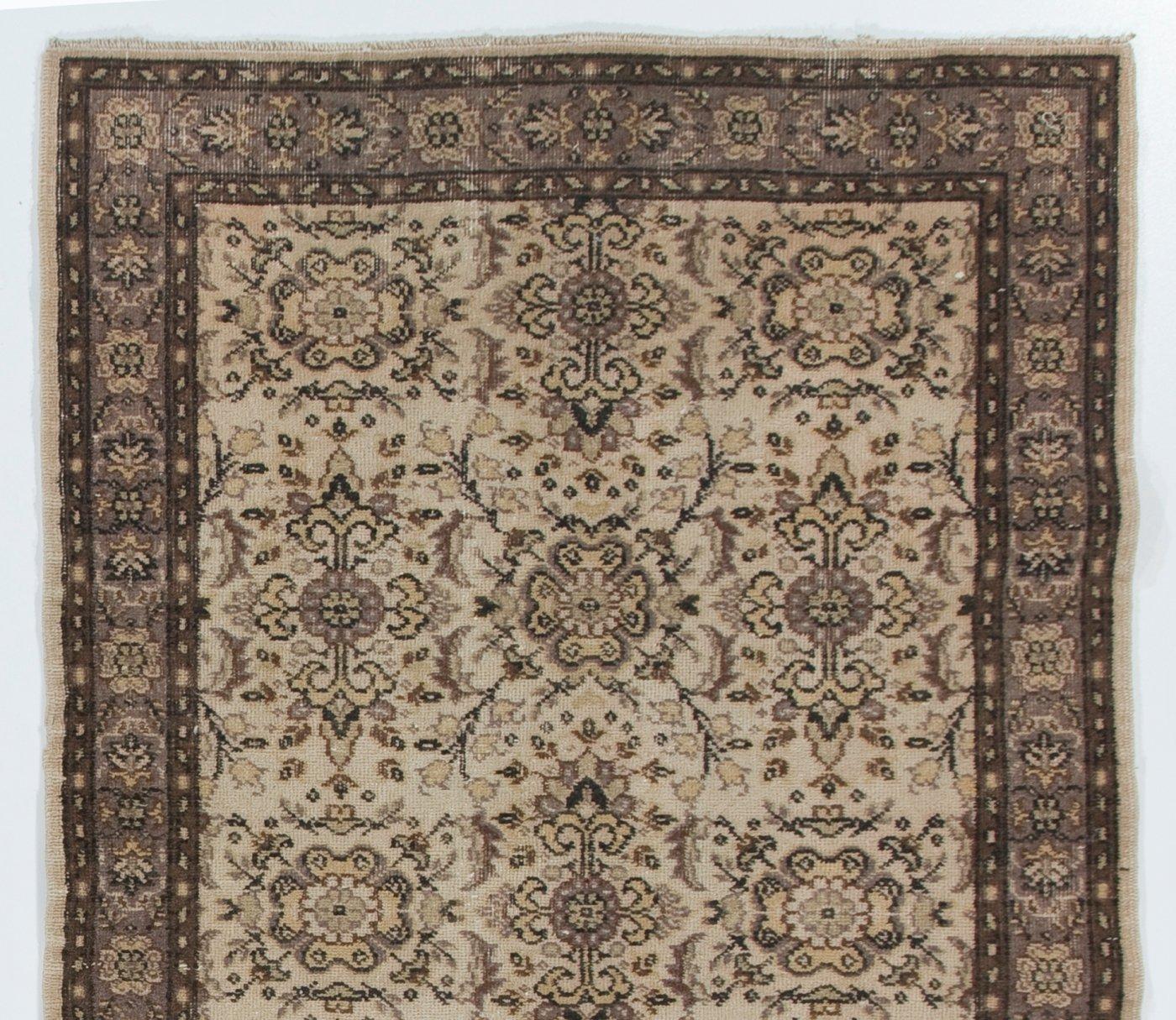 A vintage Turkish rug. Finely hand-knotted with even medium wool pile on cotton foundation. Very good condition. Sturdy and as clean as a brand new rug (deep washed professionally). Measures:4x7 ft.
 