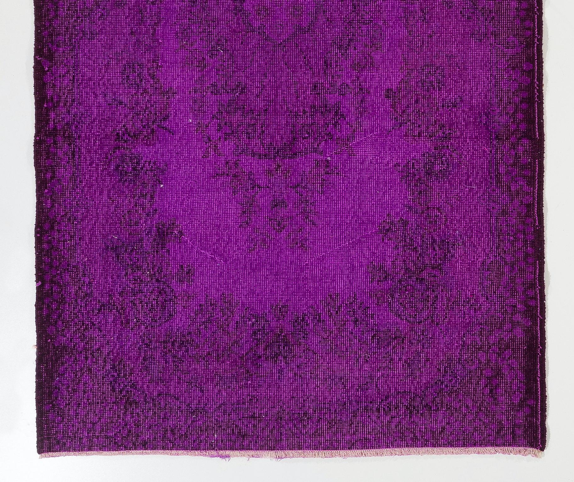 A vintage Turkish accent rug over-dyed in purple color. The rug is finely hand-knotted, has low wool pile on cotton foundation. It is in very good condition, professionally washed, sturdy and suitable for areas with high foot traffic. Measures: 4x7