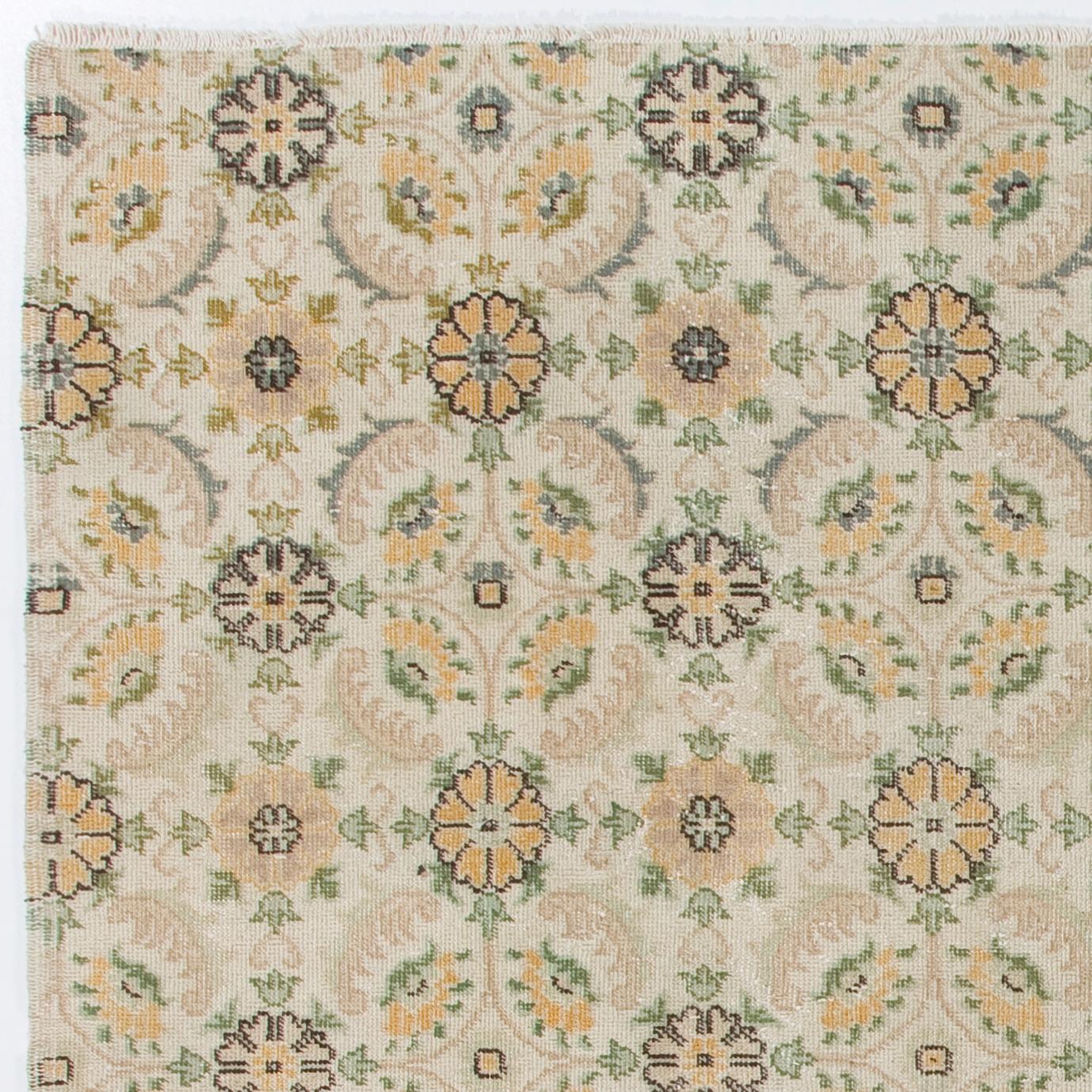 A vintage Turkish accent rug. It was hand-knotted in the 1960s and all-over floral design. Low wool pile on finely woven cotton foundation. Sturdy and can be used on a high traffic area, suitable for both residential and commercial interiors.