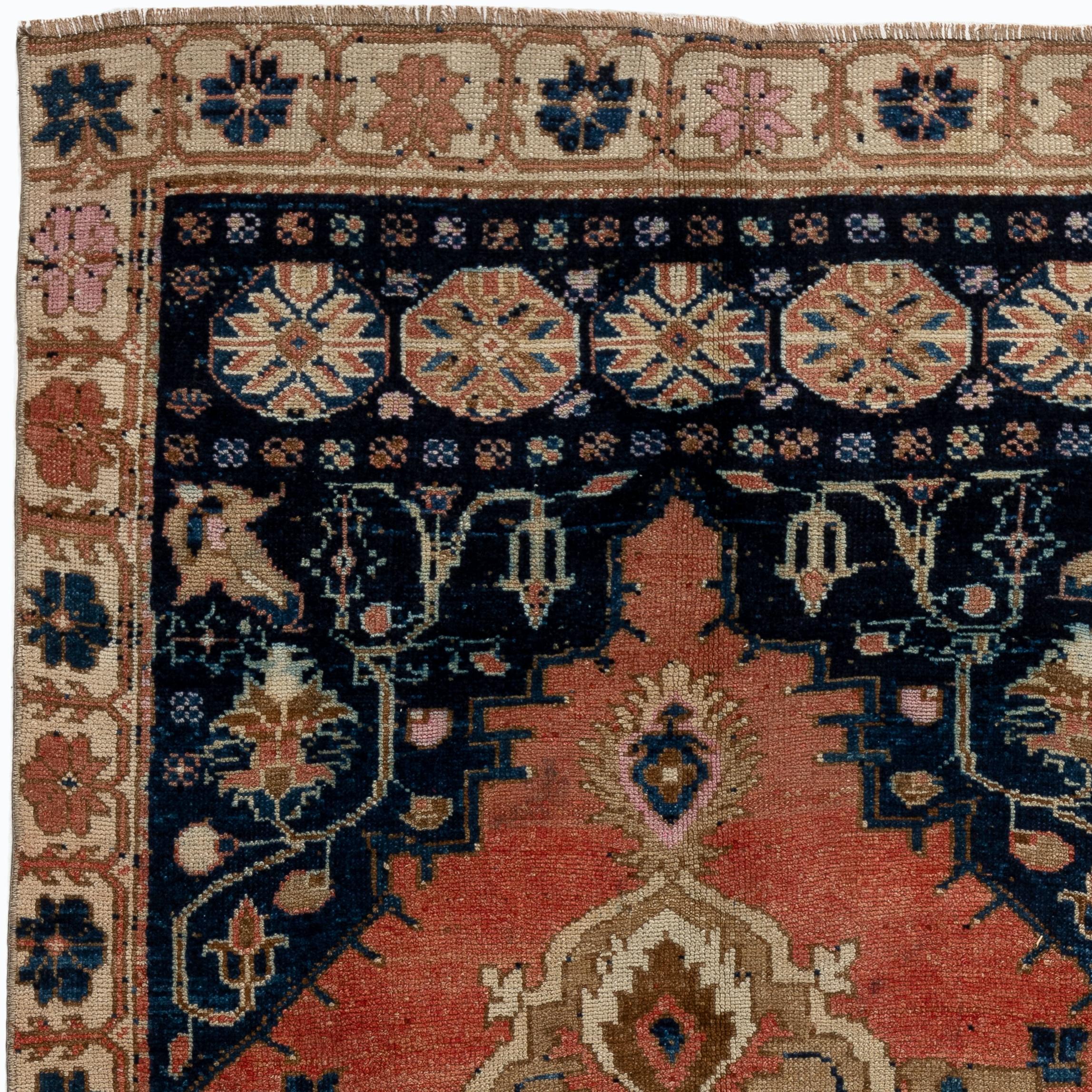 A finely hand-knotted one of a kind vintage Turkish rug from 1920s.
The rug is made of plant dyed medium wool pile on wool foundation. The red is dyed with madder and the blue is indigo. 

The rug is clean and sturdy, it can be used in both