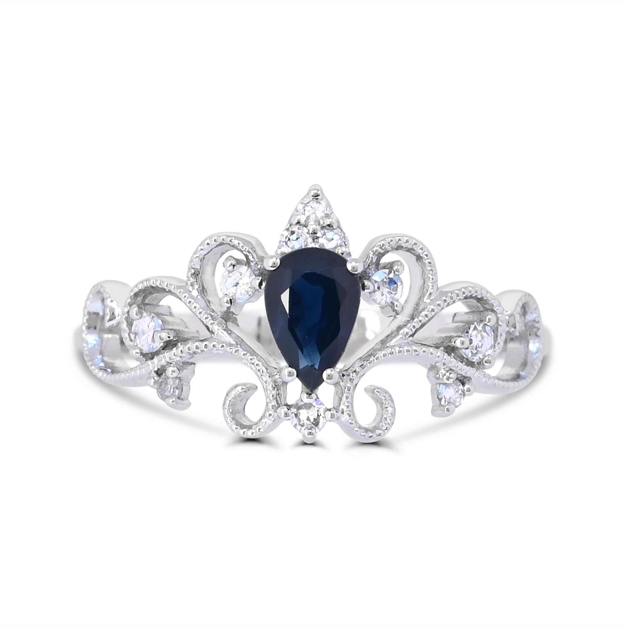 Indulge in the elegance of our Pear-Cut Sapphire and Diamond Accent Curvilinear Milgrain Shank Ring in 14K White Gold. Crafted with meticulous attention to detail, this ring boasts a stunning combination of one pear-cut blue sapphire accented by
