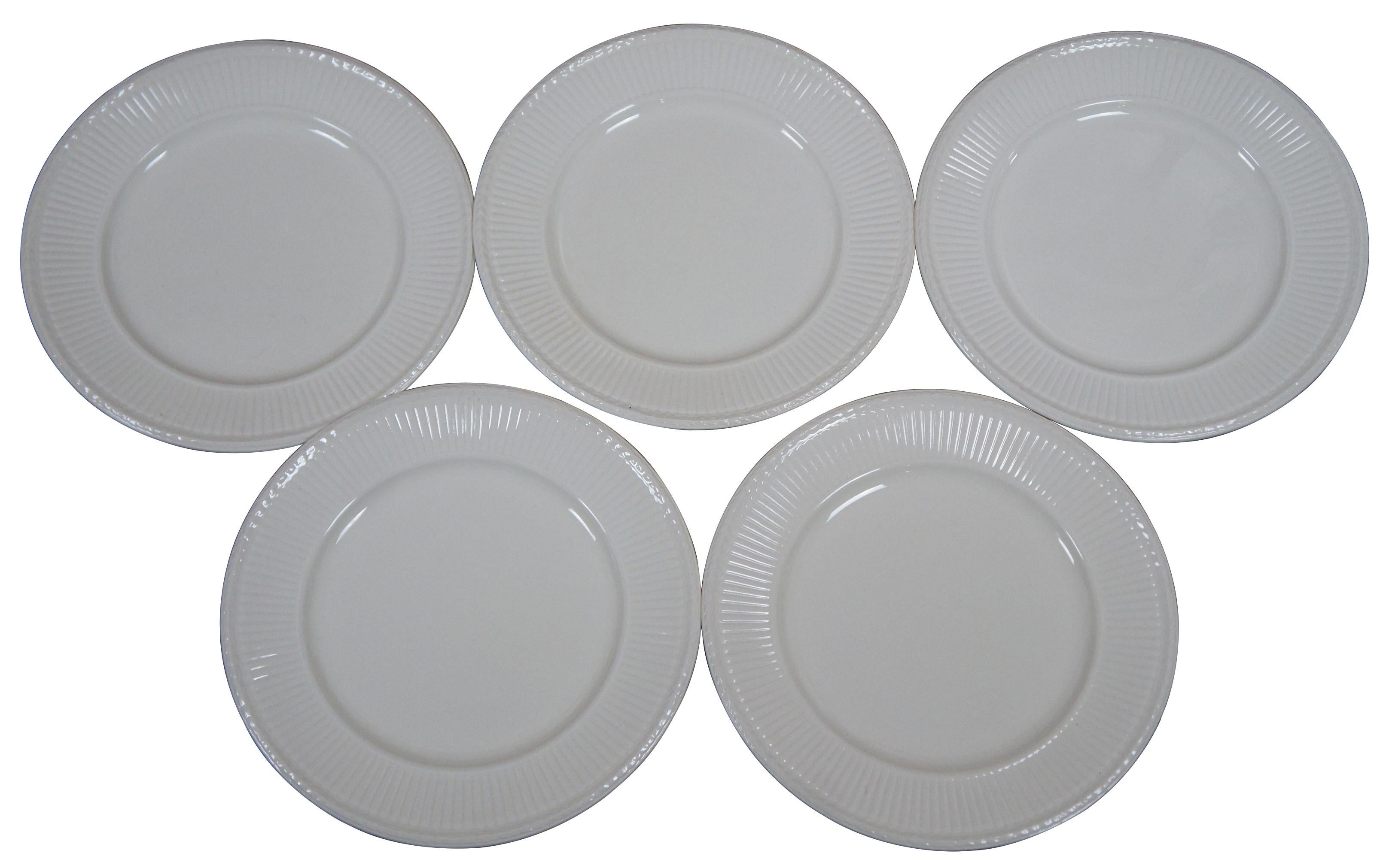 Set of five antique Wedgwood Edme white porcelain dinner plates with ribbed and laurel leaf border. Measure: 10.5