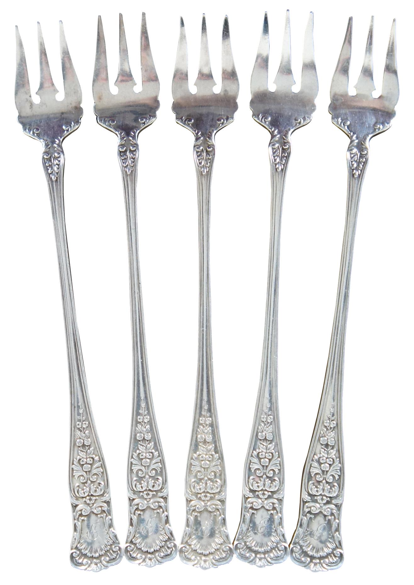 Set of 5 antique Gorham sterling silver cocktail or fish forks with floral and scallop shell pattern, engraved with a monogram “P.”

Measures: 3.625” x 5.25” / 11 g (length x width/weight).