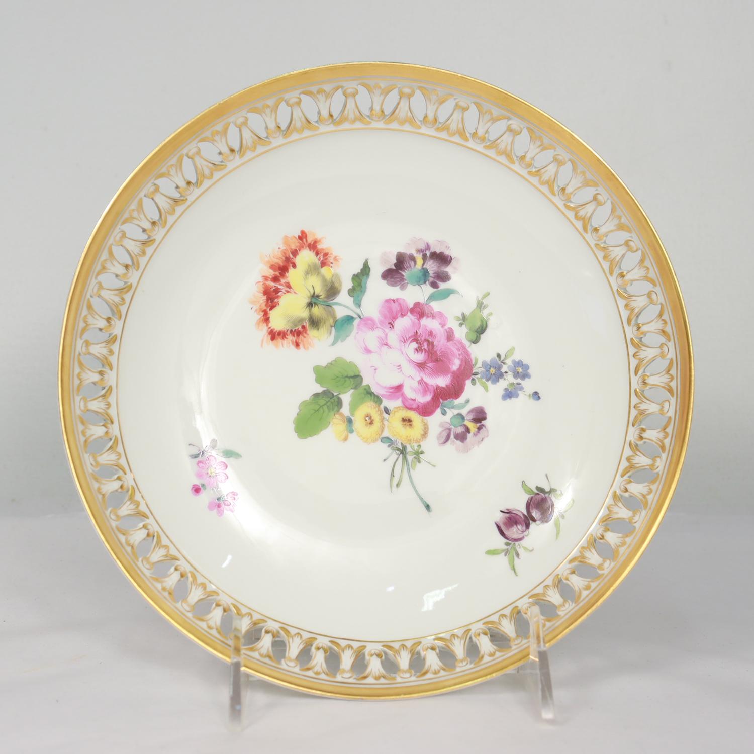 A fine set of 5 antique Neoclassical German porcelain bowls.

By Meissen.

Each with hand painted Deutsche Blumen floral sprays to the center with a reticulated rim and gilt accents.

With blue underglaze crossed swords factory mark to the base of