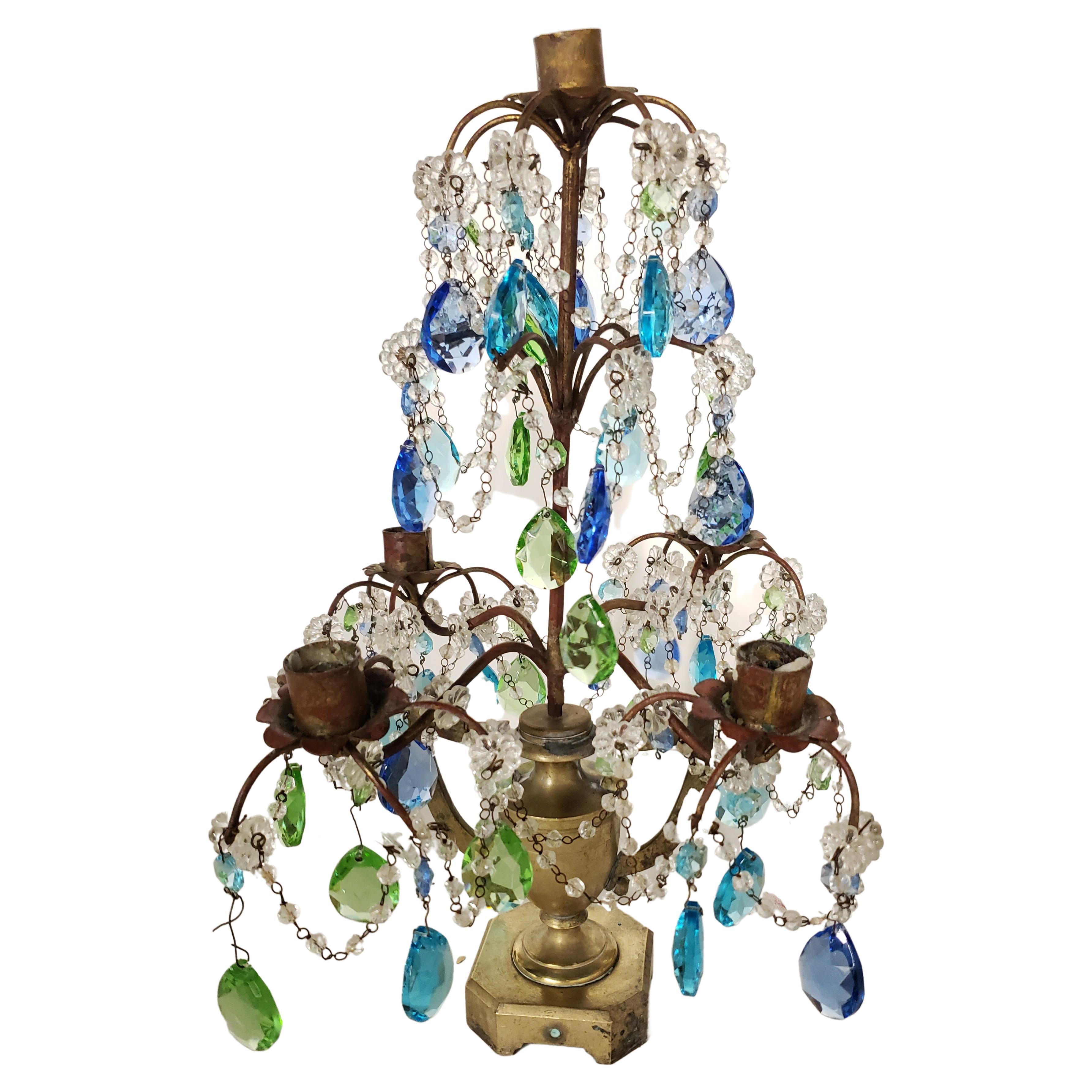 A exquisite 5-arm Solid Brass and various colors Crystal pendants Mounted Lustre Candelabra. 
May be used as a centerpiece, on top of sideboard or side table or lamp table. 
Measures 14 inches wide, 14 inches in depth and stands 17 inches tall.